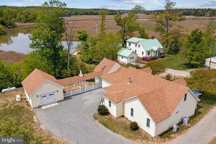 Stunning Mt. Landing Creek Waterfront Cape Cod on 1.58 Ac. with short run out of Creek to the Rappahannock River. Remodeled to take advantage of the pristine, unobstructed views of the Creek, protected wetlands, sunsets & the nature that abounds such an inviting setting. Impressive features include a Great Room with Kitchen & Living Room, Bartop, vaulted ceiling,  granite tile, ceramic tile & hardwood, recessed lighting, gas logs, stainless steel appliances, pantry, doors to covered side porch with skylights...perfect for outside dining with a Creek view, formal Dining Room, downstairs Master Suite with cedar closets, recessed lights, hardwood floors, ceramic-tiled Master Bath with dual vanities, 2 additional downstairs Bedrooms & full Bath & 2 additional Bedrooms & Bath upstairs, whole house generator, pulldown attic, dual heat pumps, 1 new heat pump, covered walkway to a 1-Car Garage with wall unit A/C, front porch for the rocking chair, pier, boat slip & shared boat ramp on Mt. Landing Creek.Additional acreage has been added for total of 1.58 Ac. Room for pool and big garden. There is a water line run from home to boat slip. Great freshwater fishing, kayaking & canoeing on the Creek & out to the Rappahannock River for saltwater fishing & boating activities...best of both worlds ! Minutes to Town of Tappahannock for Town's amenities, shops, restaurants, historic Downtown with a Riverfront Town Park, Museum, local Art Gallery & a seasonal Monthly Farmer's Market, Rappahannock River Valley National Wildlife Refuge, Marina, River Fitness, Hobbs Hole Golf Course, health care facilities & VCU Health Tappahannock Hospital. 1 Hr. from Richmond & Fredericksburg & 1.5 Hrs. from D. C. & Williamsburg. A must see one of a kind Waterfront property !