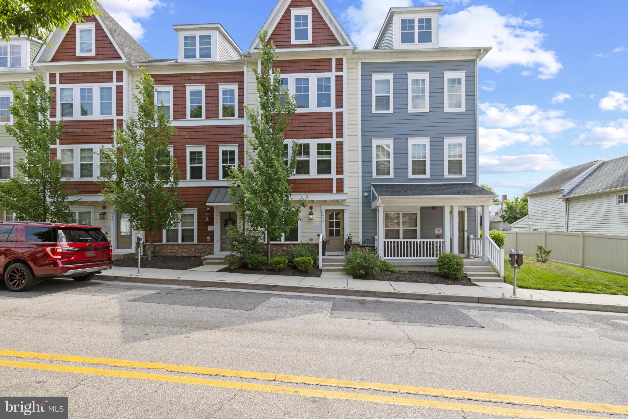Sensational two-car garage townhome conveniently located in downtown Towson, close to shopping, dining, entertainment, schools, and employment centers. This four-level townhome offers 2200 square feet of luxurious living space. The entry level features a study, which can serve as a fourth bedroom, along with a powder room and a spacious two-car garage at the rear. A coat closet is conveniently located in the hallway.
Ascending to the second floor, you’ll find an open floor plan with a stunning center kitchen equipped with high-end stainless appliances, modern cabinets, and white quartz countertops. The main level also boasts hardwood flooring, upgraded fixtures, recessed lighting, window treatments, a kitchen island with a breakfast bar, custom built-in cabinetry in the living room area, and a balcony off the kitchen.
The third level houses the primary bedroom with an ensuite bathroom featuring double sinks and a walk-in closet. A third bedroom or den also offers an ensuite full bath. Additionally, this level is equipped with a full-sized, high-end Maytag washer and dryer.
The fourth floor provides a versatile space with a third or fourth bedroom, complete with an ensuite bath, and a loft-style family room. Schedule your private showing today!