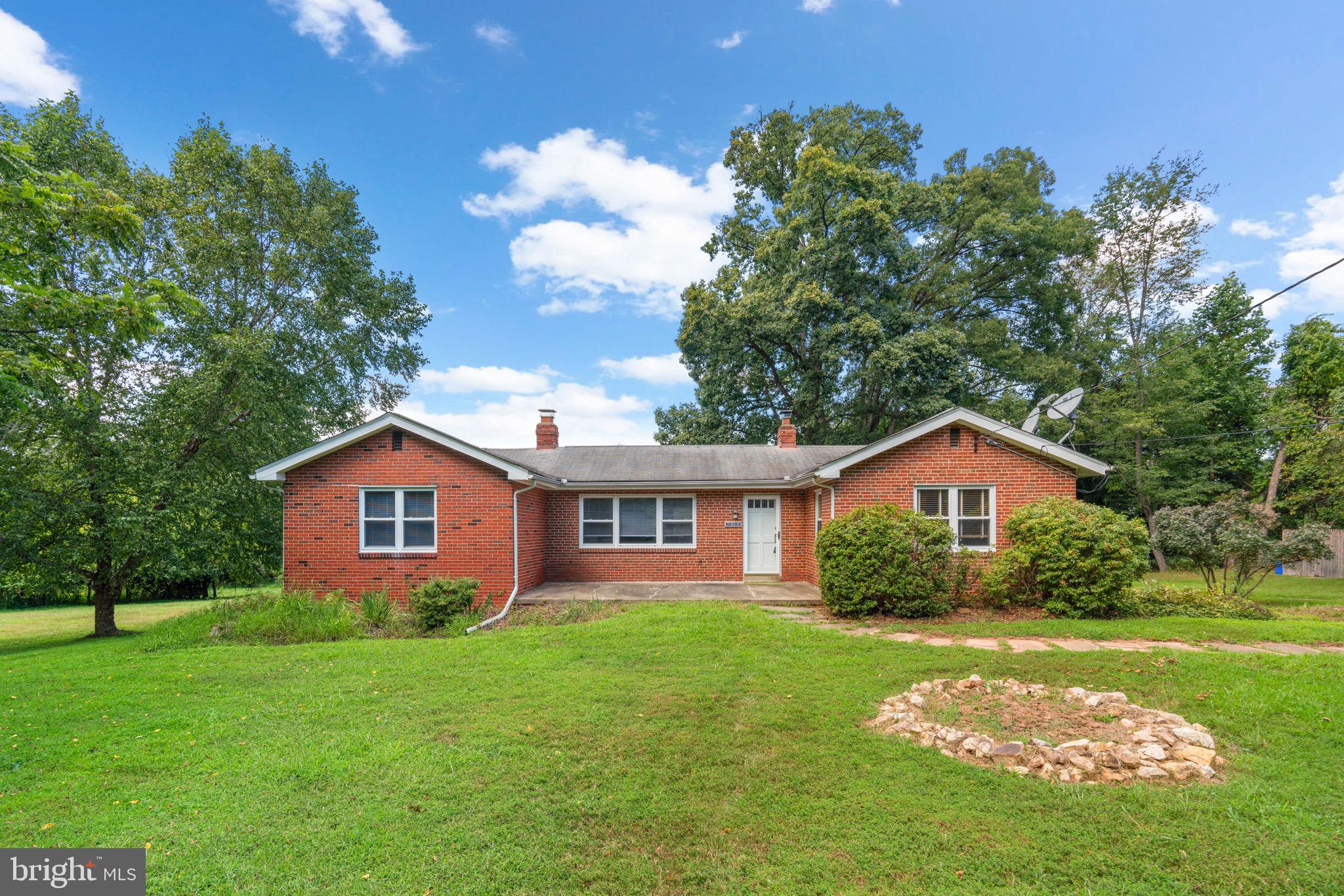 This lovingly cared-for home, built in 1947, is full of old-school charm and is awaiting your own style and ideas! Sitting on 1.67 acres, this property features 4 bedrooms, 2 bathrooms, and an abundance of natural light. Beautiful hardwood floors run throughout this home, and as you enter the home, you will see an incredible brick fireplace in the living room. As you enter the dining room, don't miss the wainscoting that lends it a modern feel, while the kitchen features plenty of prep and storage space. The basement is a blank slate, perfect for storage, a workshop, or the basement of your dreams. The views from the deck couldn't get any better, with trees surrounding you to allow for plenty of privacy for relaxing! This type of home in Olney doesn't come around very often, so you won't want to miss out! Give us a call today and let's go have a look!