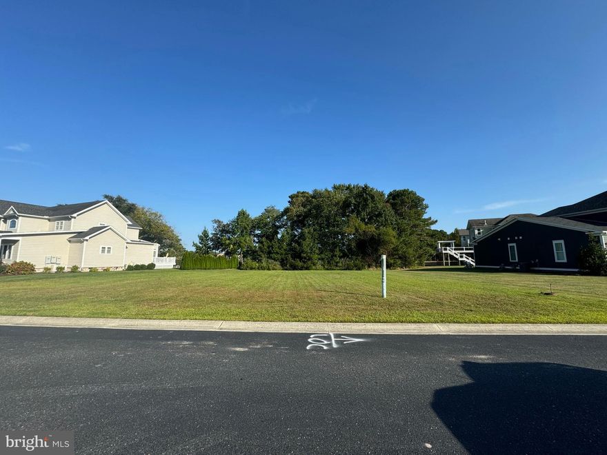 Located on an established, fully developed street within GlenRiddle, this 0.35-acre interior homesite offers a refined residential setting with a peaceful rear outlook toward Ayers Creek. The surrounding custom homes give the street an immediate sense of completion and neighborhood stability—an appealing characteristic for buyers seeking a ready-made environment rather than years of surrounding construction.

As one of the remaining buildable parcels in GlenRiddle, this lot is positioned among the most accessible price points in the community, with recent land sales and active values spanning from the mid-$400s to over $1M. This creates a compelling opportunity for buyers seeking value within a high-amenity, gated environment.


The property is cleared, offers public water and sewer, and includes a golf membership. GlenRiddle features two championship golf courses, marina access, a modern fitness center, tennis and pickleball courts, outdoor pools, a clubhouse with dining, and a full schedule of resident amenities. Situated deep within the community’s interior, this homesite provides a quiet, established feel with close access to Ocean City, Assateague Island, and the shops and dining of Berlin.