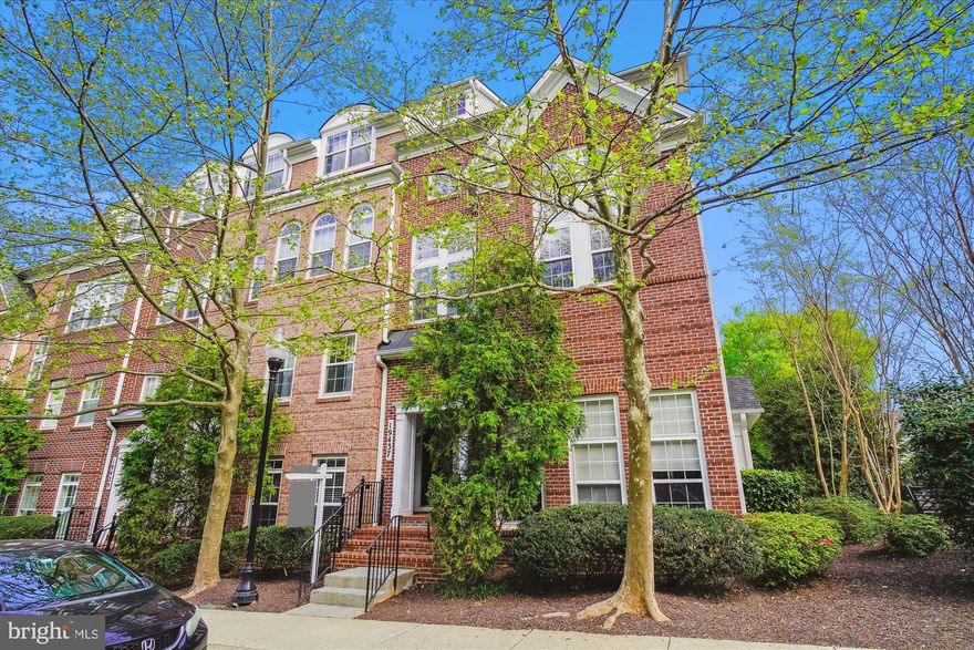 This elegant top-floor end unit offers a tranquil and private living experience with beautiful views of the swimming pool and kid's playground. With no neighbors above and only one shared wall, this home provides the perfect balance of serenity and convenience. Inside, the spacious open floor plan is flooded with natural light, thanks to soaring two-story windows in the living room that fill the space with warmth and openness. The home features natural hardwood floors throughout, and the living and dining areas are accented by crown molding, adding a touch of sophistication. The eat-in kitchen is equipped with stainless steel appliances, gas cooking, and upgraded countertops. Upstairs, the primary suite offers a peaceful retreat, with a Juliet balcony that opens to the fresh air. Additional highlights include a private one-car garage and extra driveway parking. Enjoy access to a variety of amenities, including a fitness center, and take advantage of the home’s prime location, just minutes from popular restaurants and shops and close proximity to the Marc Train station for quick access to Washington D.C. This immaculate home offers a seamless combination of style, privacy, and convenience—making it the ideal place to call home.