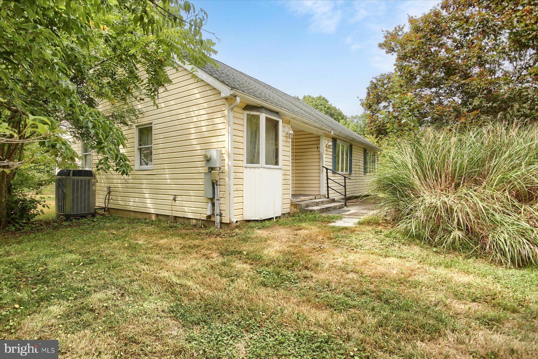 Single family home on 1.18 acre lot with 2,117 sq. ft.! Features a first floor bedroom suite, living room with hardwood floors and vaulted ceilings, kitchen with all appliances included, main level laundry with washer and dryer included, recreation room was used as a pool room, 2nd floor primary bedroom suite with 2 walk-in closets and loft space. Detached, oversized 2-car garage, fish pond, fruit trees, electric heat pump/central air, well and septic. Home is being sold "AS IS"--property is in need of TLC, inside and out.