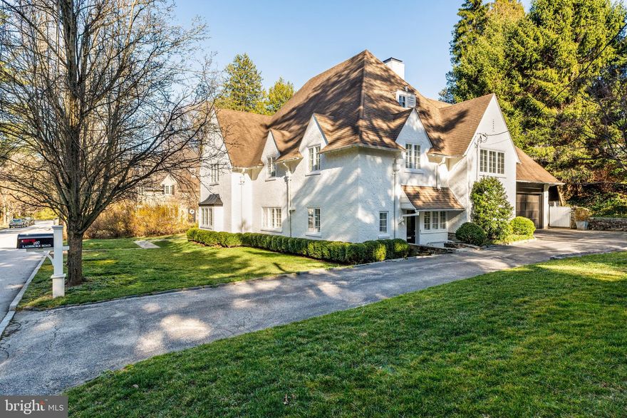 Welcome to 207 Ladbroke Road, ideally situated in the heart of Northside Bryn Mawr, on a charming cul-de-sac in one of the area’s most desirable neighborhoods. This beautifully updated 3-story home seamlessly blends classic elegance with modern conveniences, offering 4 spacious bedrooms, 2 full bathrooms, and 2 half baths—perfect for both family living and entertaining.
Upon entering, you’re greeted by an impressive 2-story entry, bathed in natural light, setting the tone for the elegance and character that flows throughout the home. The gracious Dining Room, featuring a large bay window and built-ins, leads to the renovated kitchen, complete with a large island, stainless steel appliances, ample storage, and plenty of windows. Off the kitchen, you’ll find another entrance to the home, a large mudroom with closets and a designated space for a desk or command station. The Kitchen also provides access to the laundry/storage room and backstairs.
The first floor also features an office/playroom, a powder room, and a coat closet off the front hall. On the second floor, the stunning Living Room overlooks the entry hall, showcasing a beautiful stone-surround fireplace with a wood mantle and a large bay window. Adjacent to the Living Room is a sun-drenched Den with sliding glass doors that open to a patio and the private, fenced-in manicured backyard with a stone wall .
Up a few steps, you’ll find the private bedroom level, which includes a sun-filled primary suite with 4 closets. This floor also boasts 3 additional generously sized bedrooms and 2 full bathrooms. The third floor offers an expansive great room with built-ins, perfect for use as a home office, additional bedroom, or media room. There’s also plenty of attic storage on this level.
This exceptional home features hardwood floors, abundant closet and storage space, and exudes style and charm.  Located within walking distance of the Bryn Mawr train station, local restaurants, the library, and minutes to all that the Main Line has to offer.