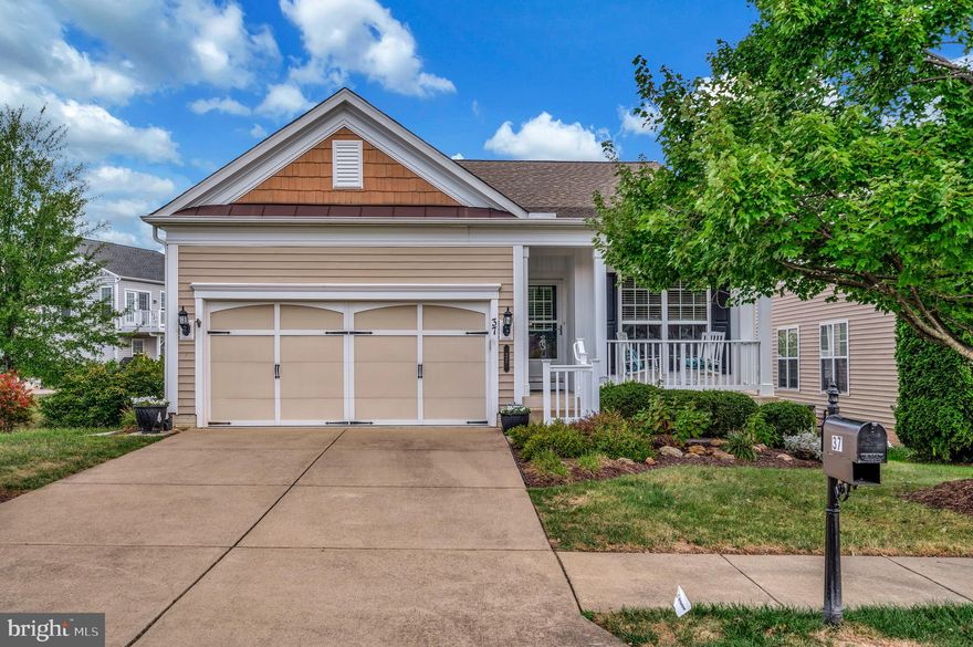 Welcome Home to 37 Mendota Way! This home features the Madison model, a popular home design in the Celebrate Virginia North community that offers a blend of features designed for modern living and comfort. The Madison model features 9’ ceilings and large windows for natural light, creating an open, spacious atmosphere.  Entering the front door, you’ll note the hardwood floors and bright white box trim and crown molding. To the right of the entrance is the spacious guest bedroom and separate full bath providing comfort and privacy for visitors. The tiled kitchen is equipped with modern GE appliances, including a built-in microwave, refrigerator, dishwasher, and gas range, ensuring culinary delights are just a step away. The attractive Corian countertops along with recessed and under-cabinet lighting, and ample cupboard space make food preparation a dream! The great room is spacious with a cozy fireplace, convenient built-ins including shelving and a desk and large windows allowing for an abundance of natural light. The open floor plan seamlessly connects the great room to the dining area, creating an ideal space for gatherings. Off the Great Room is a screened sunroom with a ceiling fan providing a three-seasons space adding to the feel of outdoor living in a warm and comfortable space perfect for relaxing or entertaining. In addition, there is an open-air composite deck ideal for grilling or to simply relax and enjoy this beautifully manicured community. The primary suite is situated off the main living area and features a tray ceiling with ceiling fan, walk-in closet and private bath with a double vanity, tile flooring, and a walk-in shower with grab bars for added accessibility. The laundry room is conveniently located on the main level with inside access to the garage that is equipped with an aluminum wheelchair access ramp. There is also a stairlift mounted on the stairs to the lower level. These accessibility updates increase independence, safety, and provide greater freedom to access all areas of the home. The finished, carpeted walkout basement offers over 1,100 sq/ft of living space with a recreation room and an office space. There’s also a spacious secondary primary ensuite and sitting area. The hobby room is a great space for crafts or games or whatever you can think of for this space. To top it off, there is a large workshop/utility room for tools or storage. Exiting through the french doors in the office space is the covered patio that offers a peaceful retreat to sit back and relax and enjoy the beautifully landscaped grounds. Additional features include a finished attached two-car garage with inside access, a concrete driveway, and underground lawn sprinklers for effortless maintenance.

Located in a friendly neighborhood, residents benefit from nearby parks, walking trails, and convenient access to local services. Owners in Celebrate Virginia North can also enjoy access to the community's amenities, which include a 30,000 sq/ft clubhouse nicely equipped with a banquet room and commercial kitchen. The community amenities are exceptional, featuring indoor and outdoor pools, a fitness center, walking trails, sports courts (tennis, pickleball and bocce!), a putting green and a full-time lifestyle director for event planning, fostering a sense of belonging. Experience the warmth of this vibrant community, where comfort meets convenience, and make this lovely home your own.

This community is located just minutes from I-95 and Route 17 providing easy access to nearby retail shops and grocery stores, medical facilities, along with a myriad of restaurants. Historic downtown Fredericksburg is just 15 minutes away and serves as a popular destination for its charming downtown area, featuring unique shops, art galleries, and diverse restaurants, and outdoor activities. Central Park located approx. 15 minutes south is available for anything you might need!
