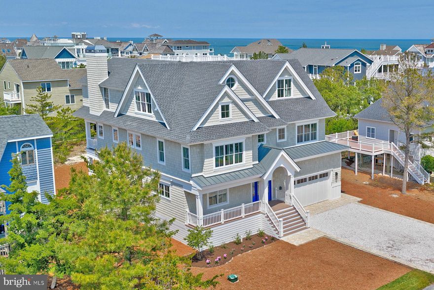 A truly once-in-a-lifetime opportunity to own a brand-new home by Marnie Custom Homes! This exceptional offering allows you to enjoy the 2026 season without the time, uncertainty, and complexity of building from the ground up. Avoid the lengthy process of sourcing a lot or teardown, securing approvals, clearing the site, coordinating builder availability, and navigating off-season construction timelines, often resulting in the loss of two full summer seasons.

A newly constructed custom coastal masterpiece, this exceptional home offers a rare opportunity to experience the pinnacle of luxury beach living in North Bethany, within a gated community just steps from a pristine and private beach. Designed for effortless entertaining, the home’s modern inverted floor plan seamlessly connects expansive interior living spaces with multiple outdoor decks, creating an ideal setting for sun-filled days, sunset cocktails, and timeless seaside gatherings.

Located just four homes from the oceanfront, this remarkable retreat was thoughtfully designed and impeccably crafted by nationally recognized Marnie Custom Homes. Every detail has been carefully curated to enhance comfort, architectural elegance, and the coastal lifestyle.

An elevator services all levels, culminating on the top floor, where a striking great room anchors the home. Here, a chef’s gourmet kitchen with professional grade stainless steel appliances and a double island flows effortlessly into the dining area and spacious living room with fireplace. This level opens to a generous screened porch and a full stairway leading to an expansive rooftop deck with sweeping ocean views, perfect for enjoying coastal breezes and panoramic sunsets.

The middle level features five spacious ensuite bedrooms, including a custom built-in bunk room and a luxurious owner’s suite. The primary retreat offers vaulted ceilings, a private vestibule, a large custom walk-in closet, and a spa-inspired bath with an oversized shower, dual vanities, and a private water closet. A well-appointed laundry room on this level adds convenience for both family and guests.

The ground level welcomes you with an inviting foyer that opens to an additional family room with access to a large rear deck and yard, offering the potential for a pool. This level also includes an additional ensuite bedroom, a spacious mudroom, a second laundry room, and ample storage. Two outdoor showers and a dedicated rinse station further enhance the home’s beach-centric design.

No detail was overlooked in the creation of this exceptional home, delivering the very finest in coastal luxury. Ideally situated within the exclusive, gated community of Bayberry Dunes in North Bethany, this home offers enduring design, privacy, and a highly sought after location.

Built by Marnie Custom Homes, an acclaimed custom builder known nationally for refined coastal architecture and exceptional craftsmanship, each residence is thoughtfully designed with intelligent layouts, elevated materials, and meticulous attention to detail, resulting in effortless luxury tailored for coastal living at its finest.

Contact us to receive updates as interior photography becomes available. Detailed building specifications and plans available upon request. Swimming pool and surrounding patio area have been virtually added and are not included. Pool design and dimensions are subject to HOA review and approval. Schedule your private tour and experience the exceptional lifestyle this remarkable beach home affords.