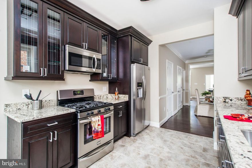 Superior Charm City Builders 3BR/1.5BA renovation in historic Resevoir Hill! Brand new hardwood floors adorn the LR and DR. Luxurious crown molding and chair rails embellish the main level's beauty. Gourmet kitchen /w ss appliances, upgraded cabinets & granite is entirely new + DECK access & .5BA on main lvl. Lrg master BR with plenty of nat light and attchd custom tile bath. 2 Yr Wrnty incl!