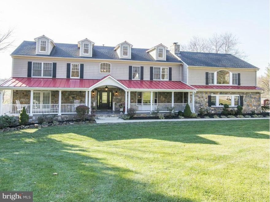 Stone, Brick & Hardiplank wrap this stately country colonial on 7 gently rolling acres. Fully unrestricted land w/ operative horse farm.  Dbl master BR - main & upper lvls. 10 ft deep slate front porch w/standing seam metal roof. Wide plank cherry hardwoods; sunroom w/270 degree country views. 30x30 upper lvl great room; upper & lower laundry rooms; oversized garage. Additional 6.5 acres available