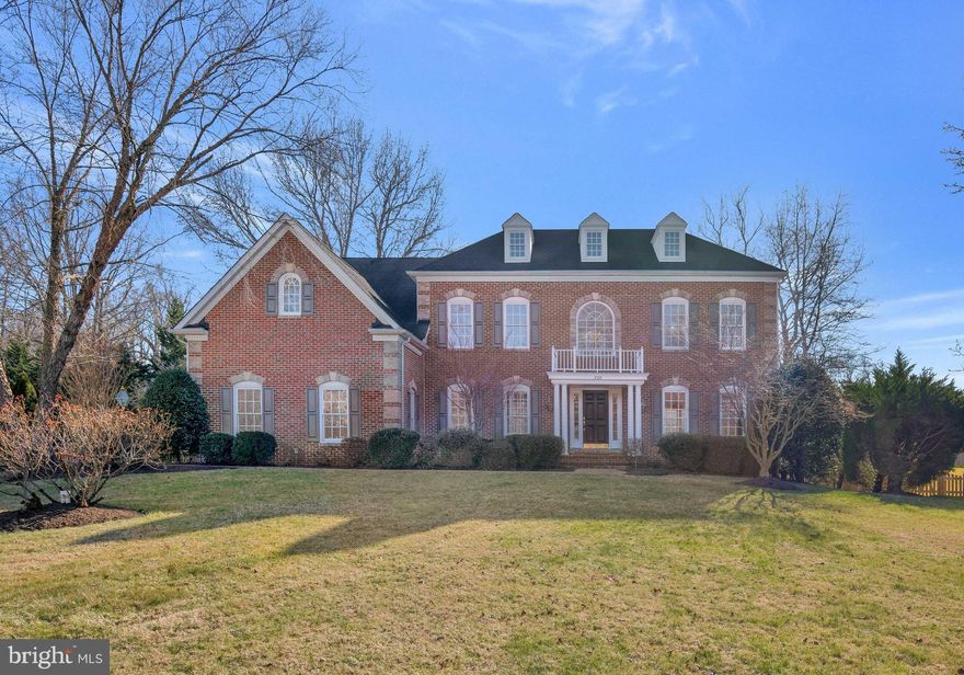 Stunning 5 bedroom, 4.5 bath brick front Colonial in Saint Stephens Estates, located on a premier lot at the end of the cul-de-sac. Great attention to detail has been made throughout the entire home with  added architectural features including beautiful chair rail, picture frame and crown moldings. The home has been freshly painted and has new hardwood flooring! Light and bright throughout!  The beautiful kitchen is a gourmet's delight, with granite top center island and separate sunny breakfast room with cathedral ceiling. The family room boasts a cozy gas fireplace and warm wood floor. The dining room with tray ceiling allows you to entertain in elegance yet dine in comfort. Built-in shelving is the perfect addition to the main level den.  Newly renovated half bath on the main level. The primary suite offers everything you could ever want. 2 large walk-in closets, sitting room, 2-sided gas fireplace and luxury spa bath. 2 bedrooms allow access to a shared bath and an En Suite bedroom is perfect for guests. The lower level is an entertainers delight, with built in wet bar and large recreation room perfect for a pool table. French doors lead in to a private office with built in desk and shelving. The 5th bedroom and a full bath allow for your weekend guests to have there own private retreat. Walk out to the gorgeous patio with hot tub and fire pit overlooking the lush landscape. This is the one you have been waiting for!