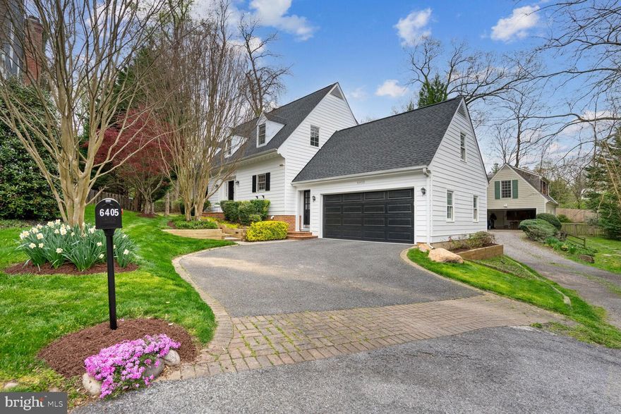 Welcome to 6405 Little Leigh Court in Cabin John, crafted by the esteemed local architect, Tom Rixey.  Upon entering, you are greeted by a grand, naturally lit foyer leading to a welcoming living room adorned with a stone hearth fire place and expansive windows that frame panoramic views of the picturesque grounds. The spacious living room seamlessly transitions to the dining room on one side, along with a paver patio on the other, extending your living space outdoors and inviting you to bask in the beauty of the surrounding greenery. This well-maintained Dutch Colonial residence features 4 bedrooms, 3.5 baths, and boasts nearly 2,600 square feet of finished living space spread across three levels.  The main level layout is ideal for entertaining guests or simply enjoying the comfort of daily living. The kitchen is a chef's delight with peninsula island seating and adjacent to the cozy family room. The upper level features a primary suite with a luxurious bath and 2 walk-in closets. There are 2 additional bedrooms on this level and a shared bathroom which serves the secondary bedrooms on this level.  The lower level of the home is a versatile space, ideal for a recreation room, fitness area, or home theater, complete with a bedroom, convenient full bath, laundry room, storage, and walk up stairs leading to the outdoors.  Stepping outside, the enchanting grounds surrounding the home beckon you to relax and unwind. The meticulously landscaped gardens, sprawling lawn, and mature trees create a tranquil backdrop for outdoor enjoyment and gatherings.  Conveniently located near shops, dining, parks, 495, the C & O canal, DC, Bethesda, and more.  Offer deadline Monday April 15th @ 5pm.