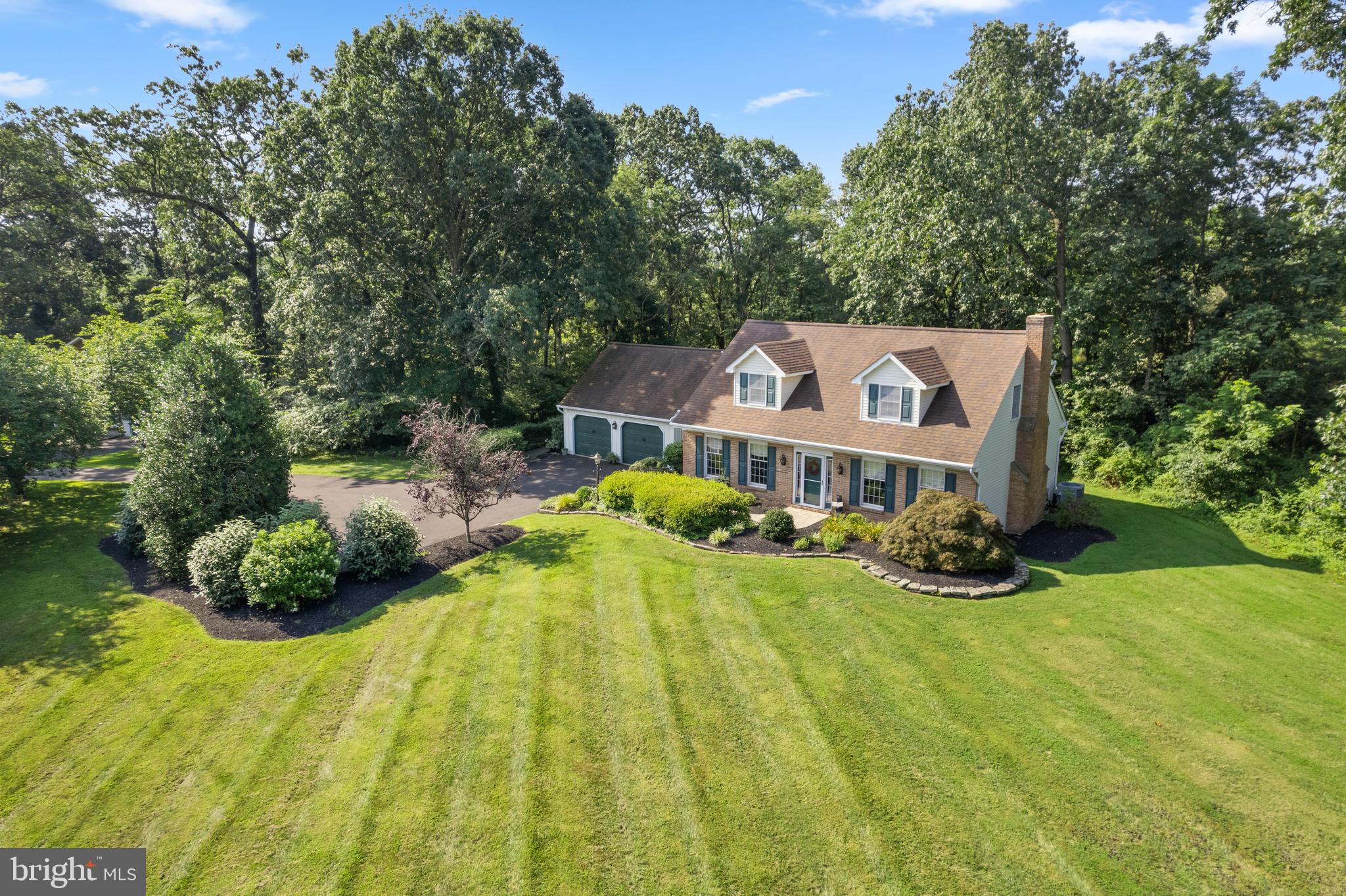 Nestled on a sprawling 2.04-acre lot, this exquisite Cape Cod-style residence exudes charm and sophistication, offering a perfect blend of luxury and comfort. If you are looking for the perfect secluded location this is it. Step inside to discover a thoughtfully designed layout that maximizes space and natural light. The heart of the home features a large eat-in kitchen equipped with a 5 x 7 butcher block center island, a built-in microwave and a sleek built-in range and dishwasher. The convenience of a main-floor laundry area, complete with an electric dryer and washer. The inviting living area boasts a stunning brick fireplace and bay window overlooking the back yard. Off of the kitchen is an expansive Family Room with walls of windows and a cathedral ceiling overlooking a wrap around deck. The second floor features a master suite with double closets and a large master bath. With a full basement featuring an outside entrance, and high ceilings the possibilities are endless. Whether you envision a home gym, a media room, or additional storage, this versatile space can be tailored to suit your lifestyle needs. The property also includes an attached garage with front entry, providing ample parking and easy access to your home. The expansive outdoor space offers endless opportunities for gardening, outdoor activities, or simply enjoying the tranquility of your surroundings. This residence is not just a home; it's a lifestyle. Experience the luxury of space, the warmth of a well-designed interior, and the beauty of nature right at your doorstep.