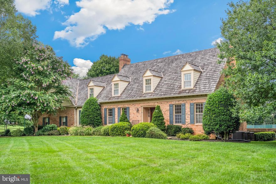 This charming brick colonial in the sought-after Belvedere community has been lovingly cared for by its original owners. Freshly painted, impeccably maintained, and move-in ready, it sits on one of the most desirable lots in the neighborhood, offering both privacy and convenience.

Property Highlights:

- Classic custom built "Gosnell Home" with timeless curb appeal
- Quality construction with custom details: molding, oak floors, beams, paneling, cabinetry, and built-ins
- Thoughtful floor plan with dual staircases and a private primary suite
- 5 bedrooms / 3 bathrooms upstairs
- 5 fireplaces, including one in the spacious primary suite
- Bright eat-in kitchen with skylights
- Finished lower level with recreation room, 2 bedrooms, full bath, and walkout
- Oversized 3-car garage with high ceilings
- Laundry / Mud Room and whole-house vacuum system

Lot & Outdoor Living - Set on a premium, private, and totally flat 2.36-acre lot,  offering an unmatched combination of space and seclusion. This sprawling and functional lot is a paradise for outdoor sports enthusiasts and entertainers.  

Amenities include:
- Swimming pool with cover and diving board
- Composite deck with pergola—perfect for outdoor entertaining
- Well-maintained tennis / pickleball court with lights
- Expansive yard with soccer goal and playground
- Beautifully landscaped grounds with sprinkler system

Recent Updates & Systems:
- Roof, gutters, and siding replaced (2020)
- 3-zone HVAC system (2021)
- Updated and inspected septic system (2025)
- Neighborhood well water

Conveniently located minutes from Potomac Oak Shopping Center and close to Potomac Village, the home strikes the perfect balance of privacy and accessibility. With top-rated schools, a close-knit community, and one of the best lots in Belvedere, this property presents a rare opportunity to own a much-loved home with incredible potential to customize and add value. 

Contact your buyer's agent today or reach out for a private showing!