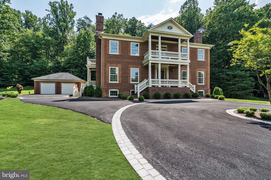 Nestled in the heart of tranquil Clifton VA this Federal style reproduction home has a craftsman quality true to its period. Welcome to 7450 Dunquin Ct. This year the kitchen was completely remodeled with new cabinets, countertops and SS appliances.  There are 3 ovens and 2 surface cooking areas... One on the oven and the other is an Induction cooktop.  The marble table in the kitchen was made to match the countertops and it conveys with the house. The house boasts Flemish-bond brick detail, 10' ceilings on 3 levels, tray ceiling-main-level library. 6 fireplaces, molding, raised panels & custom woodworking. Hardwood floors on top 2 levels, gracious room sizes, multiples balconies and porches, decks, gorgeous staircase with Chippendale railings. The walk out basement has custom paneling, bar with stone countertops, sink, refrigerator and ice maker.  The basement also has a full bath and motorized drop down projection screen from ceiling to provide home theater.  Deck in the rear and all upstairs  bathrooms have also been re-done within the past year.  Downtown Clifton offers a variety of things to do. Explore some sites with ties to the American Civil War. Go antiquing at one of the quaint shops along Main Street. Grab a burger and fries at local favorite Main Street Pub, or some creamy soft serve at Peterson's Ice Cream Depot. However you choose to spend your day, we're sure you'll love it in Clifton, Virginia.