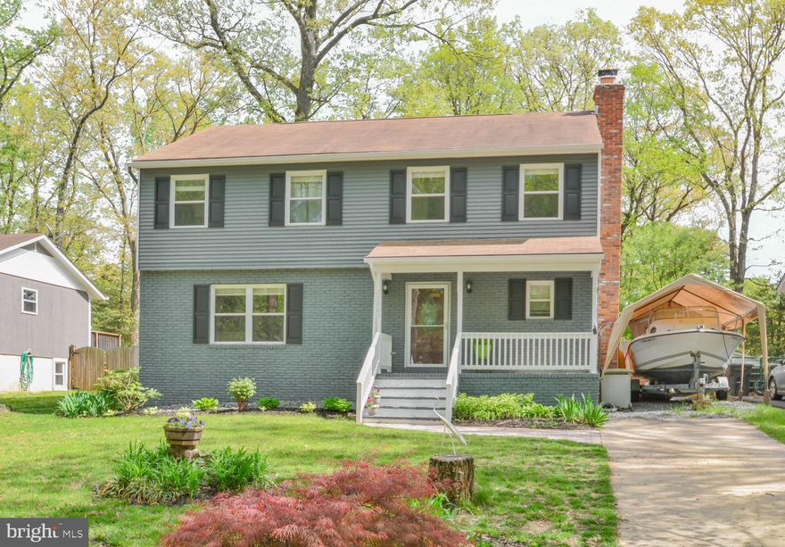 Just in time for warmer weather, you'll find this rare and beautiful two-story Colonial in water privileged Arden on the Severn! Tastefully updated kitchen includes designer white Shaker cabinets with soft close drawers, white granite counter top with plenty of space for prep and socializing, and a generous sized pantry. Upstairs you will find 4 spacious bedrooms. Master suite boasts a walk-in closet plus additional closet, as well as an en suite bathroom. Basement is fully finished with a wet bar, full sized fridge, bedroom/office, family room, and workshop.  Tons of storage inside spacious closets with organizers, multiple closets in the basement, 2 Sheds. Cozy up to the fireplace on cooler months, or step out to the spacious, privacy-fenced flat back yard to enjoy the deck, swing set, or roasting marshmallows over the fire pit under the ambient Edison lights. No green thumb needed for this landscaped yard, perennials will bloom throughout the season with little more than rain to keep them healthy. Access to 4 beaches, volleyball/horseshoes/grilling/events like beach movie nights & 4th of July fireworks over the Severn, 4 piers with boat ramps, fishing/crabbing access & tot lots. You will love making memories in this home, Life's a Beach!  Schedule a private showing today.