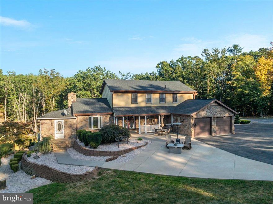 "Living The Life On Logger Dr" Welcome to your own private retreat! Stunning entrance with private gates. This 3-bedroom, 4-Full bath home sits on a private 5.24 acres! Spacious kitchen with stainless steel appliances and an eating area. Living room with beautiful wood ceiling and brick fireplace that has a wood stove insert. Den style room perfect for relaxing after a long day. Huge finished entertaining area with bar & pellet stove, perfect for shooting some pool while watching your favorite sports team.  Primary bedroom on upper level with private bathroom that has a soaking tub as well as a clawfoot bathtub that's also a shower. Two additional bedrooms on the upper level and a hallway bathroom with a second washer/dryer in it.  Finished walk-out basement with rec room area and a large bonus room that has a full bathroom. Wait until you see the outside! Enjoy summers floating in your own private in-ground pool. Upper and lower decks to sip your morning coffee, invite friends over for a party or just relax.  Your own stocked pond to fish in. Spacious yard with chicken coop, storage shed, gazebo and plenty of room for parking trailers or whatever you need to. Massive 30x60 detached garage built in 2023 with its own 200-amp electrical service, pellet stove, electric heaters and 4 garage doors. Owner has had up to 6 cars in the garage at once! Septic was pumped in June 2024. You won't want to miss this opportunity!