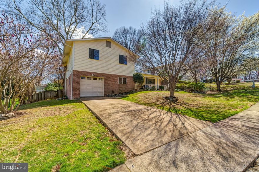 Gorgeous and meticulously maintained home in sought-after Kings Park West! This beautiful “Regent” model has been lovingly cared for and is ready for its next chapter. As you walk up, you’re greeted by the lush and landscaped front yard and serene front porch, perfect for enjoying your morning coffee. Step inside the light-filed entryway and enter into the spacious living room with a cozy fireplace and hardwood floors throughout. The large kitchen features tons of cabinet space, bartop seating, granite counters, and a large adjoining dining room, ideal for entertaining. Upstairs, you’ll find three spacious bedrooms, including the primary suite with a recently renovated ensuite bathroom. The bright, walk-out basement hosts a second bedroom, a contemporary full bathroom, and a large rec room, making a perfect private space for guests or a home office. The finished lower-level basement includes additional bonus space for living and storage. The flat, fenced backyard is ideal for dining al fresco or outdoor fun. Recent updates include a newer HVAC (2020), newer roof (2019), water heater (2018), kitchen appliances (2019), washer/dryer (2019), new basement flooring (2023), and fresh paint (2025). Appraised for more than $850K in 2024! Enjoy every amenity imaginable in this perfectly situated community – close to all the shops and restaurants at Fairfax Corner, Trader Joe’s, Target, Royal Lake Park, and more! Super convenient to George Mason University, multiple INOVA hospital centers, and quick access to the Beltway.  See this home while you can!