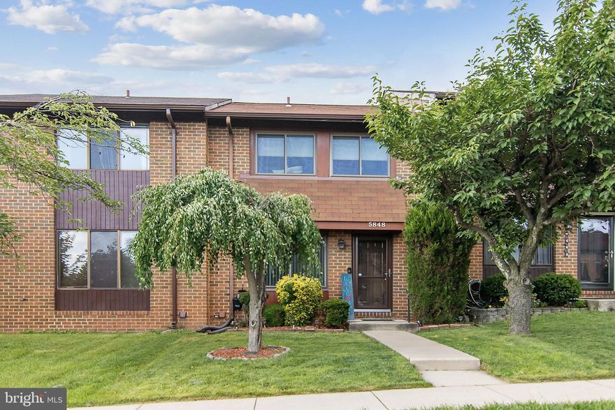 Welcome to this gorgeous all-brick townhouse with 3 finished levels. This home features so many great updates and improvements including a fully remodeled kitchen that features custom cabinets, granite counters, tile backsplash and new appliances, a spacious dining/living room combo room with new LVP floors, a wood burning fireplace and new slider to the backyard and to top it all off, an updated powder room is perfectly situated in the hallway.  Upstairs you'll find 3 roomy bedrooms with spacious closets and all share a recently updated full bathroom that's complete with an upgraded vanity & glass sliders for the shower.  On the lower level, there is a bonus 4th bedroom that comes with an attached full bathroom that has an upgraded vanity and new LVP floors, an additional workspace that's perfect for a home office and utility room with added storage space. Outside, you'll find a virtually maintenance-free backyard that is enclosed with a privacy fence that has easy access to the common area behind it. You'll enjoy spending time and entertaining guests on the new pavers patio that allows ample space for seating & grilling! Located conveniently close to shopping and major commuter routes, this well-cared for home won't last long!