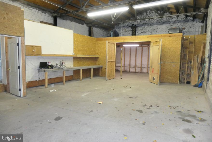 Two parcel package: One 2 bedroom home ready for rehab. One warehouse.