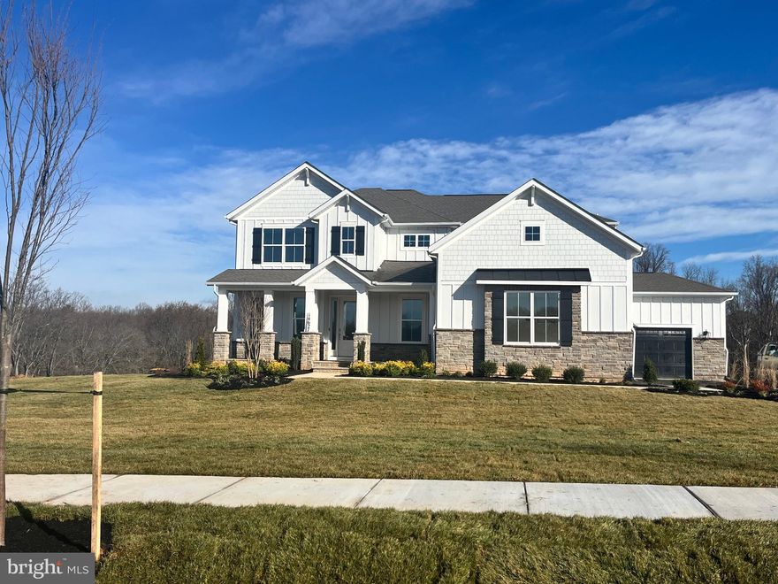 **FINAL VANDERBILT FLOORPLAN OPPORUNITY AT SENECA FARMS** February closing available. Ask about our financing incentives. Country meets luxury living on this sprawling 1.61 acre, 5 bed 4.5 bath home that backs to conservation area. The "Vanderbilt" features a 1st floor primary bedroom suite with tray ceilings, and a spa inspired bathroom with dual vanity, frameless shower, separate garden tub, and oversized walk-in closet. The primary bedroom leads out to a back covered porch with a breezeway to the kitchen. The chef's kitchen features quartz waterfall countertops, cooktop, stainless steel built-in microwave oven, soft close cabinets, optimal pantry storage, and dedicated casual dining area. The 2-story foyer opens to a flex space that is usable as a home office or formal dining. Laundry room located off the 3-car side load garage. The 2-story living room features a total of 8 windows facing the private backyard space, giving optimal opportunity for natural light. The oak staircase walks up to the loft with engineered wood floors throughout all the hallways; 3 bedrooms and 2 full baths (one en-suite), complete the second floor. Basement includes a finished rec room, bedroom and full bathroom. Price listed is for final, complete home. *Photos not of actual home, and are of a similar model*