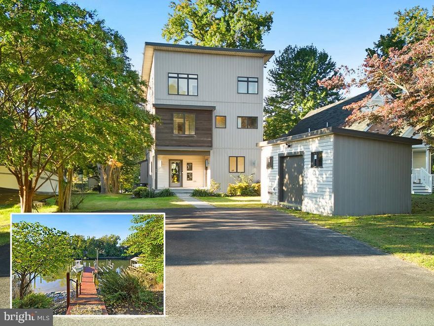 Experience waterfront living at its finest in this exquisite, almost new home in the convenient Bar Harbor community. Designed for comfort, style, and effortless entertaining, this residence showcases Rock Creek water views and thoughtful craftsmanship throughout. The private pier offers two boat lifts and quick access to the Chesapeake Bay.
Inside, a light-filled open layout welcomes you with wood flooring and a two-story great room that is flooded with light. Enjoy sitting by the gas fireplace in colder months or gather with friends on the spacious Trex deck with built-in grill against the scenic backdrop. The gourmet kitchen serves as the heart of the home — complete with a generous island perfect for casual dining or hosting gatherings. There’s so much flexibility in the use of space! There is a main level office that could serve as a formal dining room or bedroom, with a full bathroom around the corner.
On the second floor, there are two ample bedrooms that share a hall bath, and a third bedroom that has an ensuite bathroom. The top-level primary suite is a true retreat, featuring a spa-inspired bathroom, wet bar, two walk-in closets and laundry. The bedroom is large enough to have a sitting area. It opens onto the covered porch to take in panoramic water views or unwind with an evening movie under the stars. The lower-level rec room is another alternative entertaining area. An oversized shed next to the parking area provides a lot of storage for boat gear and outdoor toys.
With its blend of sophistication, comfort, and coastal charm, this contemporary waterfront residence offers the perfect escape for those who love life on the water and want to enjoy a crisp, modern aesthetic.