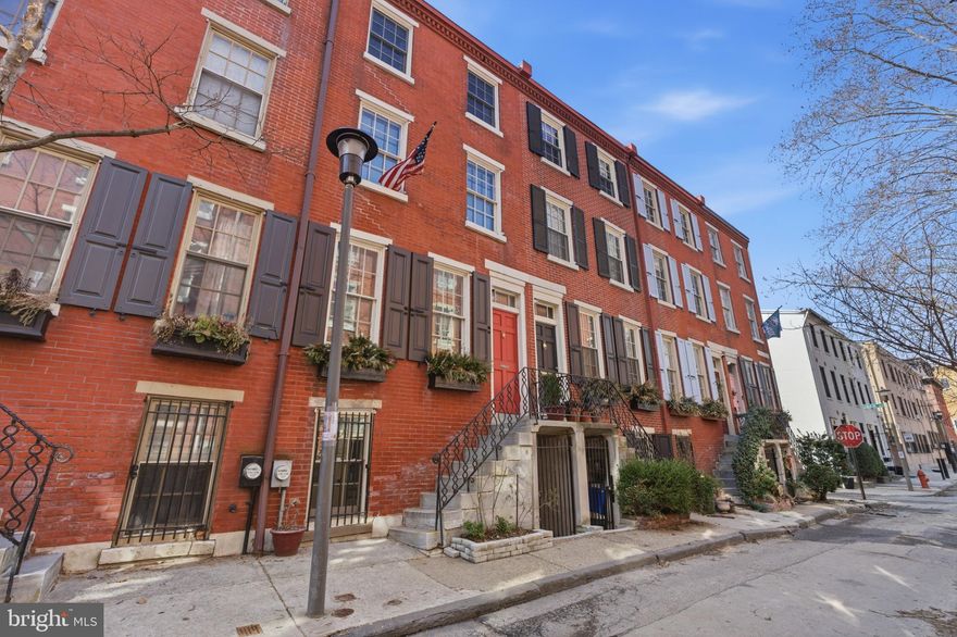 Welcome to 1918 Waverly Street. Nestled on the picturesque, tree lined and highly coveted “Ringgold Place”, once ranked the #1 block in the city by Philadelphia Magazine, this stunning historic trinity-style townhome offers a rare opportunity to own a piece of Philadelphia history in the heart of Rittenhouse Square. One of just 26 homes on the National Register of Historic Places, this residence seamlessly blends timeless architectural charm with modern updates! Inside, the thoughtfully designed interior features hardwood floors throughout, abundant natural light, and multiple new windows installed in 2024/25. The inviting living room showcases a cozy fireplace and charming window seat overlooking the serene private backyard with exposed brick walls. The beautifully updated kitchen (2024) offers sleek new Silestone countertops, stainless steel appliances, and a charming dining area with built-in bench seating and storage, perfect for everyday living or entertaining. Additional amenities on this floor include a powder room and “secret closet” to hide the home's systems/utilities. Upstairs, two spacious bedrooms each feature their own beautifully renovated en-suite baths (2023), providing both comfort and privacy. The second-floor bedroom can double as an office with a murphy bed and gorgeous built-in shelving. The primary suite on the third floor is a luxurious retreat with custom closets, stunning en-suite bath and the easily accessible stacked washer/dryer. Step outside to your own private oasis—an ideal setting for morning coffee, outdoor dining, or relaxing in the heart of the city. Perfectly located just steps from Rittenhouse Square, world-class dining, shopping, museums, and the Theater District, with convenient access to the University of Pennsylvania, Drexel University, CHOP, 30th Street Station, and major highways. Within walking distance to the highly sought-after Albert M. Greenfield School, this exceptional home offers the perfect balance of historic character, modern luxury, and unbeatable Center City living. Make your appointment today, this location is truly one of a kind and will not last long!