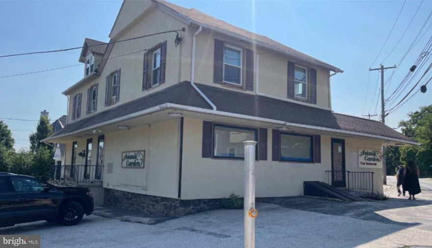 Mixed-use building within walking distance to downtown Wayne shops and restaurants. The building includes a first floor commercial space with an open floor plan, two recently renovated apartments on the upper floor (1-Bedroom & 2-Bedrooms - include washer & dryer) and a basement.  Corner lot location with on-site parking. Commercial zoning permits a wide range of uses from retail store, restaurant, personal service, office/studio and others.