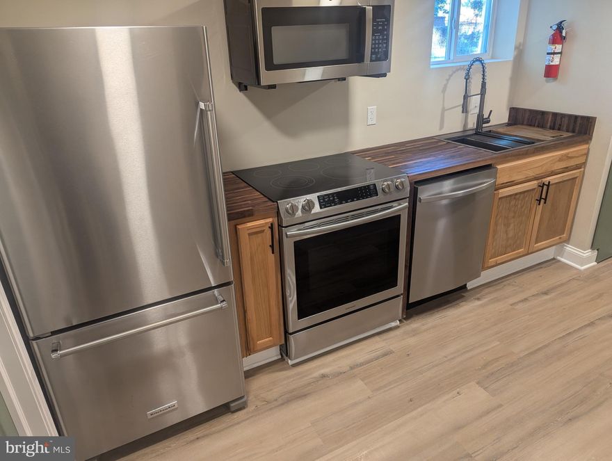 Private unit apartment style, separate floor.  This is a newly renovated 622 sq ft, one-bedroom, one bath, BASEMENT UNIT rental featuring off-street parking and a relaxing sunroom.  The modern kitchen includes stainless steel appliances: stove, dishwasher, refrigerator, large sink, walk-in pantry closet, butcher block countertops, and easy-maintenance laminate flooring. There's also a washer and dryer, as well as central air conditioning and heating.
The large bedroom offers dual closets, and the remodeled bathroom adds to the updated feel of the home.
Utilities are included in the rent—electricity, gas, water, and internet.  Parking is available right in front of the unit. Private front door entryway, recessed lighting, storage closets, and access to common grounds are also included.  Conveniently located with easy access to bus stops, the subway, shops, restaurants, and military bases. Just minutes from Washington, D.C., and Virginia.
Requirements: 620+ credit score and good rental history (some exceptions may apply)
Security deposit and application fee required
Pets considered on a case-by-case basis (additional monthly fee applies)
12-month lease Discounts for seniors (55+) and military members.
Federal and state assistance programs are welcome.