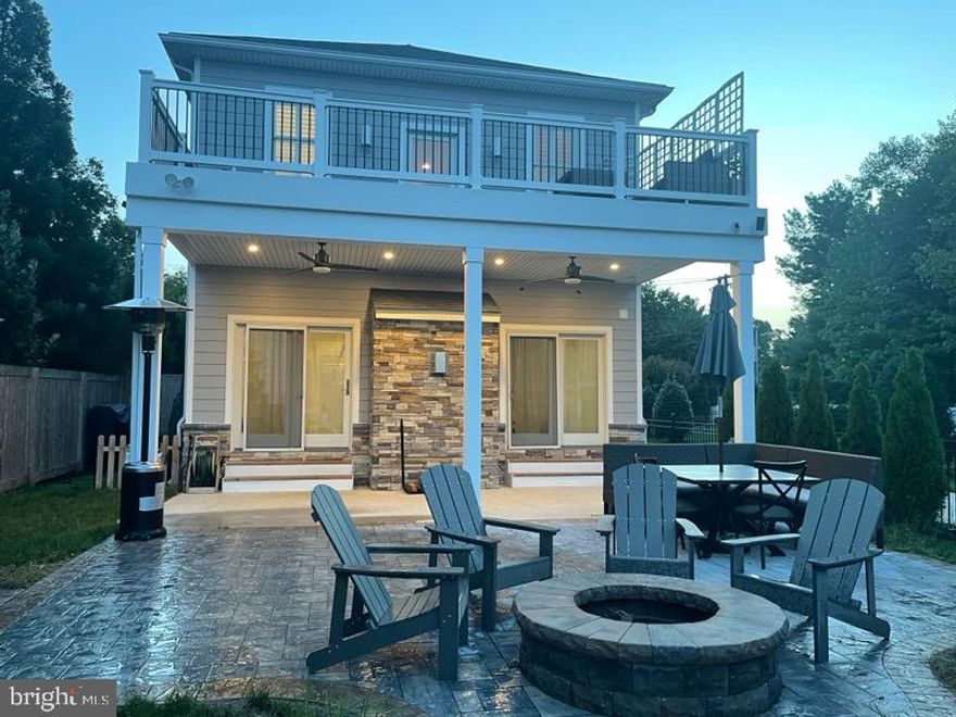 Hold on to the railing or you will be blown away by this Gorgeous home!  Built in 2019 with all the bells and whistles.  Starting with the kitchen...  top of the line appliances include six burner stove, convection microwave , dishwasher and monogram built in fridge and not to forget the 10.5 ft seamless granite island and walk in pantry.   Main living area/Great Room complete with fireplace , plantation shutters and hardwood floors,  The owners suite walk-in closets and amazing attached bath with dual shower heads with body jets and dual vanity's , heated towel rack and jetted tub.  Upper level has 4 spacious bedrooms and  3 full baths. Lots of Storage too!  Wonderful features include ,  Irrigation system,  beautiful professionally built patio with firepit, upper level trex deck off master with amazing water view of the Magothy River , Fully fenced yard  !!  You will not be sorry you scheduled a tour of this home.