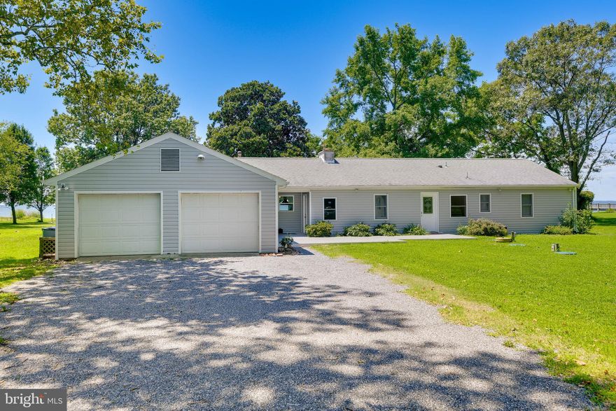This is the kind of place where weekends feel longer, coffee tastes better, and the view steals the show.

Tucked away on over 2 peaceful acres at the end of a quiet road, this furnished waterfront Ranch/Rambler delivers the best of Cornfield Harbor living with sweeping views of the Potomac River near the Chesapeake Bay. With 3 bedrooms, 2 full baths, and approximately 2,601 square feet of finished space, there is plenty of room to gather, unwind, work remotely, or simply disappear for a while.

Inside, the home feels bright, open, and easy. Large windows capture the water from multiple rooms, while the spacious family room is made for game nights, movie marathons, and lazy afternoons. The kitchen is beautifully updated with granite countertops, white cabinetry, tile flooring, recessed lighting, stainless appliances, an induction cooktop, GE Advantium wall oven/microwave combo, and handy island drawer refrigerators.

Step outside and the lifestyle really begins. Enjoy the wraparound deck, wide-open yard, mature trees, river breezes, and big-sky views. There is room to entertain, relax by the water, grill after a day of boating, or watch the birds drift across the shoreline. Two sheds, a 2-car garage with workshop space, and a custom playhouse add even more function and fun.

Lightly used as a vacation home and sold furnished, this waterfront escape is ready when you are.