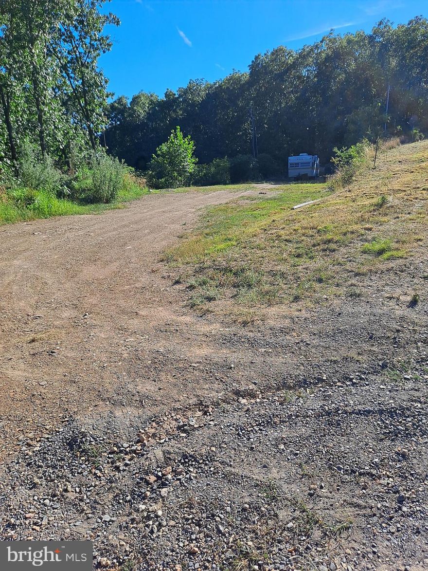 You must see this gorgeous wooded lot for sale in the Badlands Ranches Subdivision in Maysville, WV! This beautiful piece of "Almost Heaven" West Virginia is perfect for building your forever home. The lot comes with public water, septic, and electric already available. Nestled in the tranquil Badlands Ranches Subdivision, the property offers privacy and peace, with access to excellent fishing at the community's man-made lake. Additionally, it's a great spot for hunting and ATV riding, making it an outdoor enthusiast's dream. Don’t miss out on this incredible opportunity!