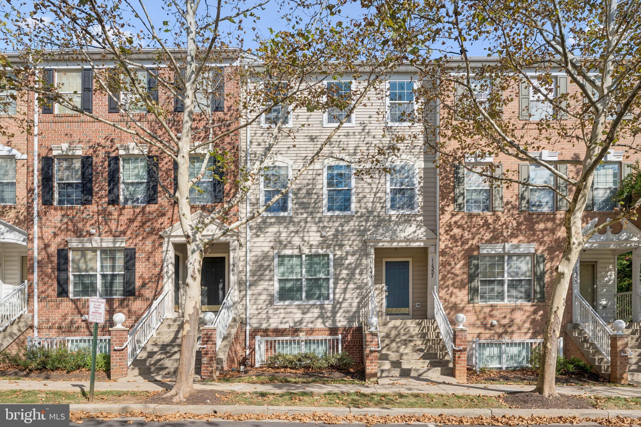 Welcome to this spacious three-level townhouse in the desirable Hearthstone Village community of Silver Spring. Offering over 1,700 square feet of thoughtfully designed living space, this 3-bedroom, 2.5-bath home combines comfort, convenience, and style just two blocks from the Wheaton Metro Station.
The main level features updated, wide plank hardwood floors, a bright family room, and an inviting dining area with a cozy gas fireplace that opens to a private balcony. The eat-in kitchen is equipped with stainless steel appliances, a breakfast bar, and plenty of cabinet storage. A powder room completes the main level. Upstairs, the primary suite impresses with vaulted ceilings, dual walk-in closets, and a spa-like en-suite bath with jetted tub and walk-in shower. Two additional bedrooms share a hall bath with tub/shower, and the second-floor laundry adds everyday convenience.
Additional highlights include a one-car attached garage and community amenities with condo fees covering exterior maintenance, lawn care, master insurance, reserves, and snow removal. With its prime location in sought-after Hearthstone Village—just steps to shopping, dining, and Metro—this home offers the perfect blend of modern living and commuter-friendly convenience.