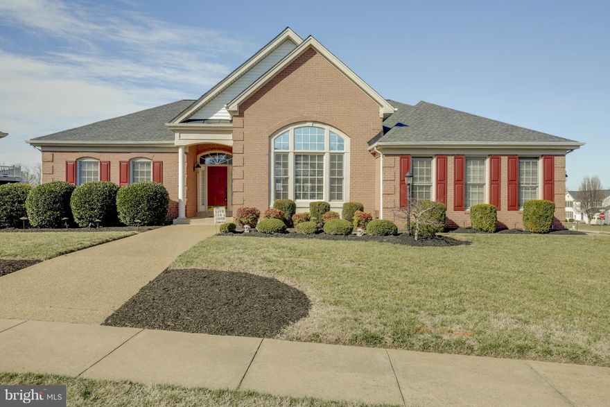 Spectacular home w/high-end upgrades & dramatic architectural details! Easy 1 lvl living! Approx. 5,400 fin sq ft open floor plan, soaring 15' ceiling, gourmet Kitch w/Sub Zero & Wolf appliances, gleaming wood floors, large owner's suite w/spa like MBA (designer tiles, Jacuzzi, seamless shower). Walk-out bsmt w/home theater, bar, rec room,5th BR & full BA,gym, craft room. 34' deck & patio
