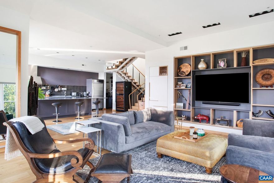 Truly one of the finest condos in Belmont and the Downtown Charlottesville area! This 3 bedroom / 3.5 bath, two level, penthouse condo in the well maintained Belmont Lofts is a rare offering, and features 3,150 finished sq.ft. of living space, extra high ceilings, a modern & open floor plan with huge windows & doors, two separate main level balconies, gourmet kitchen with stainless steel appliances and granite countertops, a large 1,000 sq.ft. rooftop terrace - perfect for entertaining - with stunning views of the Downtown Mall all the way around to Monticello. Contemporary & chic flair with many fine architectural details, inviting spaces, built-ins galore, plus wonderful amenities, including several acres of lovely garden & common space, as well as secure parking & storage. All of this coupled with the ultra-convenient location - being walkable to downtown and some of the finest restaurants in town - make this the perfect downtown abode!,Granite Counter,Wood Cabinets,Bus on City Route,Fireplace in Great Room