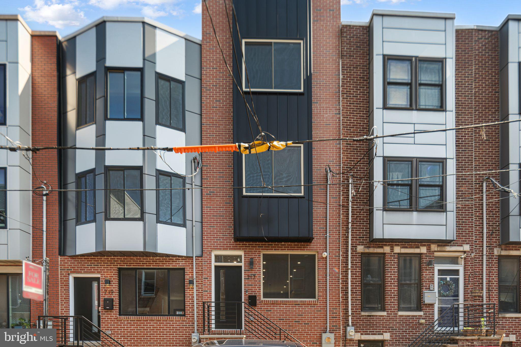 ***SPECIAL FINANCING!!! YOU CAN GET AN INTEREST RATE ON THIS HOME ONE POINT BELOW MARKET RATES (IN THE 5's), NO MORTGAGE INSURANCE (PMI) WITH AS LITTLE AS 3% DOWN & GRANTS FOR THOSE THAT QUALIFY***
Welcome to 717 Mercy Street, a stunning new construction home located in the heart of South Philadelphia’s sought-after East Passyunk Crossing. With a full 10-year tax abatement, this impeccably built single-family residence offers nearly 2,000 square feet of thoughtfully designed living space across four spacious levels.
Boasting 4 bedrooms, 3 full baths, and a convenient powder room, this home is loaded with high-end finishes and modern upgrades. From the moment you enter, you'll appreciate the 14-foot-wide lot that provides an extra-spacious living room, enhanced by crown molding, built-in speakers, and a smart home setup featuring Nest and Ring devices.
The open-concept dining area flows seamlessly into a gourmet kitchen outfitted with quartz countertops, a full-size island, subway tile backsplash, and white shaker cabinets with under-cabinet lighting. Stainless steel GE appliances include a double-door refrigerator, dishwasher, and gas range. Just off the kitchen, step outside to your private rear patio—perfect for outdoor dining and entertaining, complete with a 6-foot privacy fence.
On the second floor, you'll find two well-appointed bedrooms, a full hallway bath with a soaking tub and quartz-topped vanity, and a convenient stackable laundry closet. The third floor features an entertainer’s dream—an oversized wet bar with a glass tile backsplash, sink, and beverage fridge—leading to the luxurious owner's suite with tray ceiling accent lighting, ample closet space, and crown molding. The spa-like ensuite bath includes a double vanity, quartz countertops, and a large glass-enclosed shower with upgraded fixtures.
Enjoy panoramic 360-degree city views from the sprawling roof deck, where you can take in the Philadelphia skyline, stadiums, and bridges. The fully finished basement adds even more living space with a third full bathroom and extra storage under the stairs.
Don’t miss your chance to own this exceptional home in one of South Philadelphia’s most vibrant neighborhoods. Schedule your private tour today!