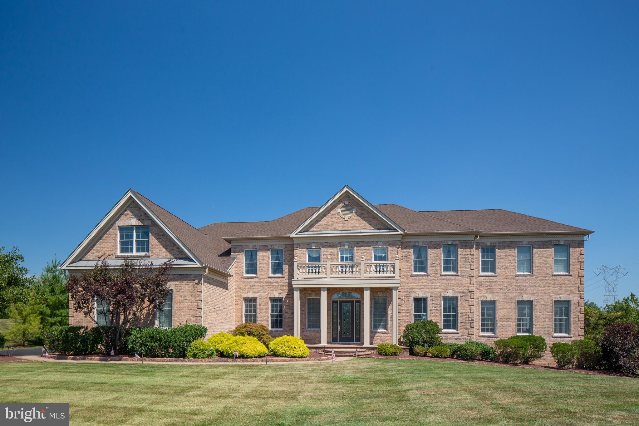 Welcome to 1028 Azlen Lane. A warm and inviting 5 bedroom semi-custom home located in scenic Hilltown Township Bucks County. The Estates at Hilltown is a community of executive style homes within the Pennridge School District surrounded by lush greenery and natural landscaping creating a private and serene atmosphere. Chic and sophisticated, with over 9600 square feet of living space on 3 levels. This home is architecturally enhanced at every turn; evident in the dramatic 2 story entryway with double turned staircases, coffered ceiling and rich hardwoods throughout the entire main level of living. The open floor plan of this home offers numerous levels of entertaining and relaxing options with effortless flow throughout the main level from the formal living and dining rooms to the conservatory and expanded kitchen. The 2 story expanded family room with fireplace and lots of natural light is open to the sunny breakfast room and expanded gourmet palladium kitchen with additional cabinetry, featuring double ovens, built-in microwave, granite counters, tile backsplash and stainless steel appliances. A dream kitchen for any level of cooking aficionado. The Grand Conservatory offers additional gathering space with built in bar, cabinetry and refrigerator. Also located on the main level is a convenient study with built-in book cases. 2 powder rooms and custom laundry room complete this level of living. Continue to the second level where the master suite offers a quiet get-a-way with it's own sitting room, oversized bath with soaking tub, 3 walk-in closets and an additional bonus room. Additionally 3 en suite bedrooms plus an additional bonus room or 5th bedroom with 2 large closets and built in desk area finish the upper level. You will be amazed by the lower level of approximately 3000 square feet of finished space, featuring another level of complete living . Enjoy a full 2nd gourmet kitchen with custom cabinetry, stainless steel appliances and built-in oven and microwave, along with a separate custom wet bar, family room and dinning area. A complete media room with theater seating will offer endless entertaining options for family and friends. Additionally you'll find an exercise room, full bathroom and storage areas and to top it all off a custom wine closet. Easily accessible from the kitchen on the main level is a custom patio with private outdoor space. A full stucco remediation was completed in 2019 using Hardie Plank Siding along with a majority of windows being replaced plus new doors in the basement and laundry room. Additional features of this home include a three car garage with built-in openers, hardwired alarm system and underground sprinkler system. No detail of this home has been left untouched. Meticulously maintained on every level. Easily accessible to shopping and major roadways for easy commuting. Truly a stunning home that suits todays lifestyle!! Furniture negotiable.