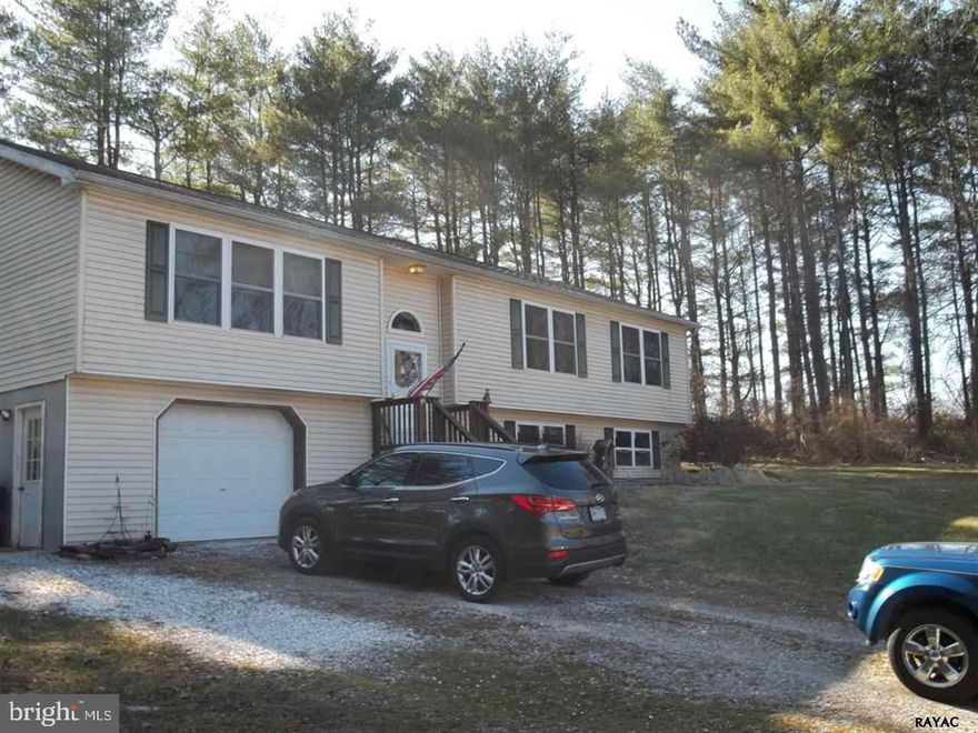 Secluded high rancher on 3.04 acres with above ground pool.