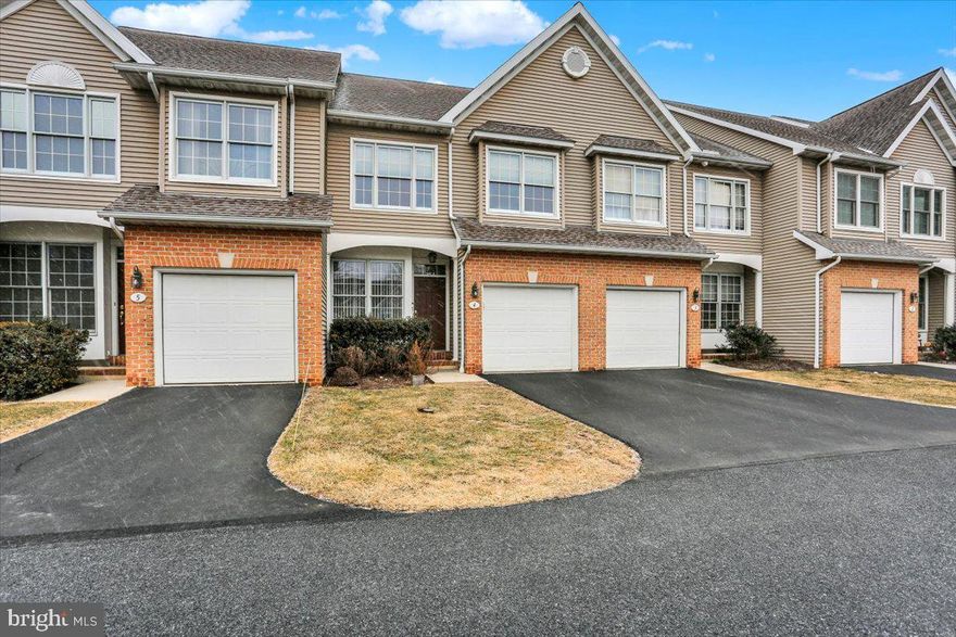 Welcome to this lovely Wyomissing townhome with a great open layout.   Enter the covered front entry and you are immediately welcomed into the bright and cheerful living room that leads into the open dining room.  Details include light hardwood flooring and chair rail molding.  You will enjoy the eat-in kitchen which is open to the stunning two-story family room.  The kitchen features an eat-in serving counter overlooking the breakfast room.  Host family and friends in the spacious family room as you sit by the gas fireplace with the decorative mantle.  An abundance of natural light throughout the first floor is provided by the large windows as well as the sliding doors that open to the large, raised deck overlooking a green and wooded backdrop.  A half bath, a coat closet, access to the one car garage and access to the finished lower level complete this floor.   Upstairs you will find the spacious primary suite, brightened by large windows and a vaulted ceiling, plenty of closet space and a primary tiled bath.  There are two other nicely sized bedrooms, a full bath and for extra convenience the laundry set up is here as well.  Additional space is added by the expansive lower-level rec room which has recessed lighting, storage and an additional half bath.  This area is perfect for movie watching, exercise equipment, games or more.  This maintenance free  home is close to beautiful Wyomissing  park system, the pool, and the school.   Call now!