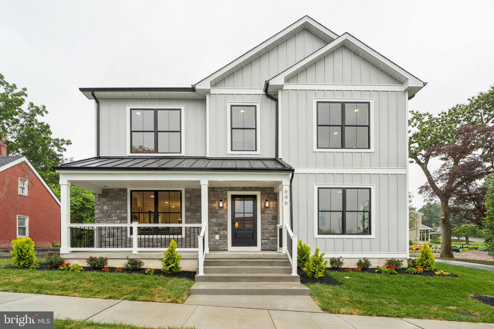 Welcome to The Charleston, a signature build by PCG Builders - Phoenixville’s premier homebuilder and leading infill developer. This newly constructed modern farmhouse blends timeless design with high-performance construction in one of the borough’s most walkable and desirable neighborhoods.
From the moment you step onto the wide front porch, you'll notice the craftsmanship and attention to detail: vertical board and batten siding, standing seam metal roof accents, stone façade, black windows, and sleek exterior lighting set the tone. Inside, discover an open-concept floor plan with wide plank LVP flooring, oversized windows and 9-foot ceilings throughout the 1st floor, 2nd floor and basement.
The heart of the home is a beautifully designed kitchen that blends warmth and sophistication. Featuring natural wood cabinetry, quartz countertops and backsplash, high-end stainless steel appliances, and a generous walk-in pantry, it’s both functional and stunning. A large center island with seating anchors the space, flowing effortlessly into the dining area and spacious living room - ideal for entertaining and everyday comfort. An additional office or flex room offers versatility to fit your lifestyle.
Upstairs, find four spacious bedrooms including a primary suite with a spa-like bath and large walk-in closet. A full hall bath and convenient second-floor laundry complete the level.
Live just blocks from downtown Phoenixville’s restaurants, cafes, and trail system - all while enjoying the space, privacy, and peace of a new construction single family home.
Now move-in ready. Schedule your private tour today!