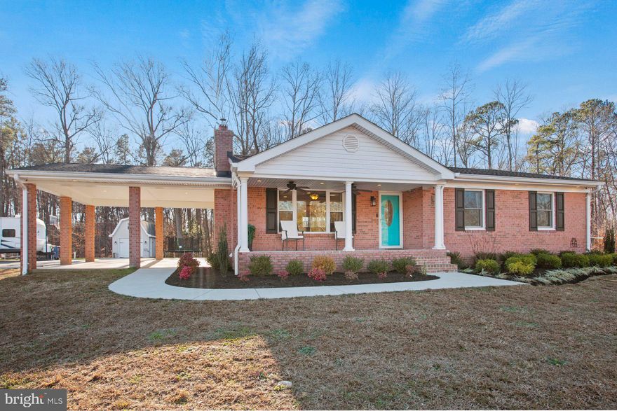 Welcome home to this pristine all brick rambler conveniently located in the heart of Mechanicsville!! Nestled on a sprawling 1.72-acre lot, this home offers a perfect blend of classic appeal and modern amenities. With 2,450 square feet of thoughtfully designed living space, this residence boasts comfort, style, and functionality.  Upon entering, you are greeted with gleaming hardwood floors and the warmth of the open floor plan, seamlessly connecting the living, dining, and kitchen areas. The recently renovated kitchen is a chef's delight, featuring brand new cabinets, granite countertops, high-end appliances, and an island that's perfect for your morning coffee. Whether you're hosting a family gathering or a cozy dinner party, this space is sure to impress your friends and family.   The kitchen flows right into the family room and offers the perfect space to relax after a long day.  Grab a book and cozy up next to the fire and escape the cold night.  Down the hall are 3 spacious bedrooms with ample closet space.   The basement has been renovated and features a 4th bedroom, 1.5 bathrooms, a second kitchen, a den/5th bedroom, and a private entrance.  The basement is perfect for a larger family or to use as an income producing rental.  The exterior of the property is just as impressive as inside. A 2-car carport provides convenient and covered parking, while multiple sheds and outbuildings offer versatile spaces for storage, hobbies, and play houses for children.  Have you ever wanted your own eggs? There's even an impressive fenced in chicken coop for that.  At night sit around the fire pit and gaze at the stars.  The vast 1.72-acre lot provides plenty of room for outdoor activities, gardening, or simply enjoying the serenity of the surroundings.  One of the standout features of this property is the new roof, installed in 2021, ensuring both durability and peace of mind for years to come. Whether you're lounging on the porch, exploring the expansive grounds, or entertaining guests in the open living space, this beautiful rambler is a haven of comfort. Don't miss the opportunity to make this house your home!  For a private tour, reach out to me today.