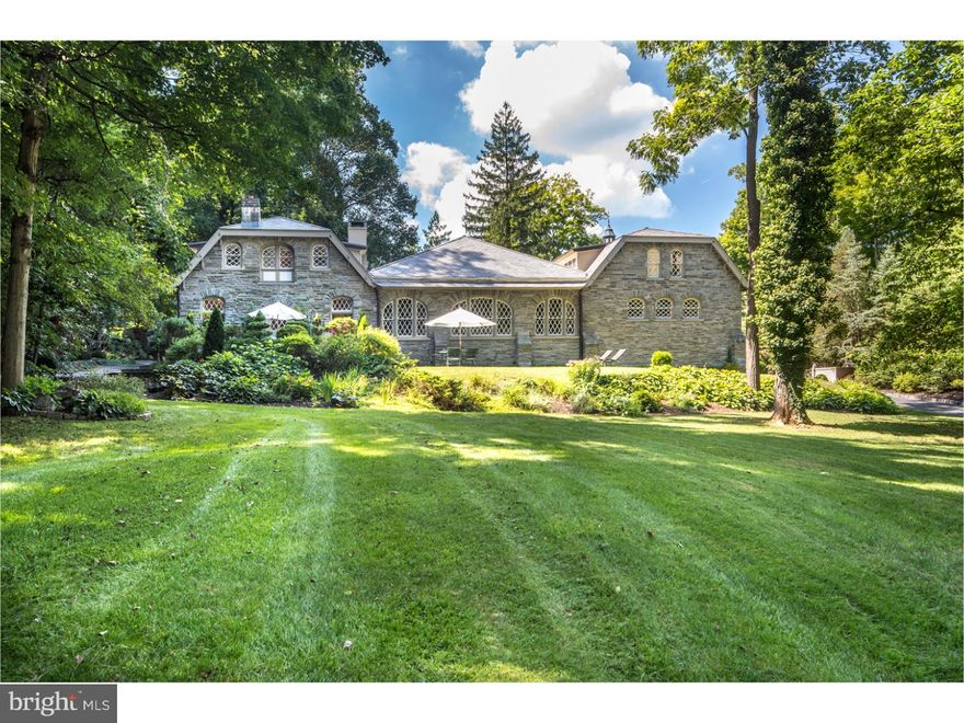 What was the carriage house of the 150-acre Dunminning Estate is today an architectural marvel with historic elements meticulously preserved by the current owners. Among the last remaining structures from the 1887 estate & one of the largest carriage houses of its era, this prized property was lovingly restored & renovated after its purchase in 1995. Utmost attention was paid to retaining the original details & structure while incorporating the finest modern upgrades. This hidden gem amid breathtaking grounds is truly one-of-kind, built with an all-stone foundation & stone wall construction making it strong, safe, quiet & fun! The experience of this handsome classic yet luxurious house is unrivaled, with an exhaustive list of distinctive features to appreciate such as original diamond-patterned fenestration, exquisite woodwork/stonework & the addition of 3 fireplaces. The piece de resistance is the incredible central great room accessed by 12' sliding mahogany doors, the ultimate living/entertaining venue. This ballroom-size "court" w/diamond windows filtering in lovely light, a soaring hand-laid clay tile ceiling & radiant heat concrete floors is great for large parties, complete with dining, screening, billiards & piano areas plus a multi-seat bar, with lots of room left for play & parking your exotic sports car! Beyond a wide archway sits the former horse stable, now a finely-appointed chef's dream kitchen graced by 14' beamed ceilings, oversized cabinetry, granite & sealed wood counters & stainless steel appliances. The open-concept layout continues w/an adjoining butler's pantry, breakfast area & FR with a masonry brick fireplace. Across the great room behind detailed sliding doors awaits a formal gathering space w/a fireplace & wood-beamed ceilings. An adjacent library w/walls of custom built-ins, a walk-in closet & en-suite bath + an office provide intimate study & workplaces. An open sky-lit loft connecting the 1st & 2nd levels, which once occupied a carriage lift, serves as a fabulous office. The upper level w/3 BRs, a hall bath & laundry is highlighted by the stunning master suite w/a sky-lit fireside BR for viewing the moon & stars, a sitting room & French Lime Stone bath. A massive cellar workshop for all your projects + ethereal gardens/outdoor terraces make this an unequalled Main Line retreat. Close to Newtown Sq., Wayne & King of Prussia for convenient shopping & dining. Only 30-40 min. to Center City & the airport!