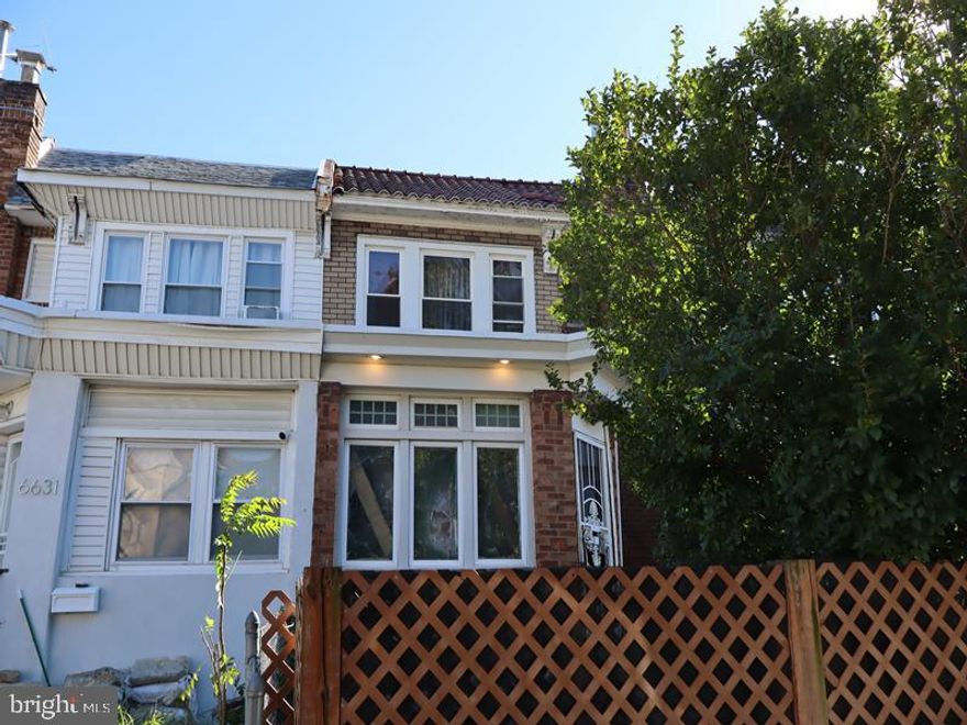 Fabulous two-story brick row home built in 1925, located in the desirable West Oak Lane section of Northwest Philadelphia. This charming property offers an abundance of space and classic character throughout. Step into a spacious living room that flows seamlessly into a formal dining area and a well-sized kitchen with walk-out access to the rear landing. The upper-level features four bedrooms and a three-piece hall bath. The full, unfinished basement provides excellent storage potential and walk-out access to the rear driveway, offering convenient off-street parking. Enjoy plenty of on-street parking as well, with the added benefit of being close to public transportation, local shopping, and just a short drive to Center City. Minutes from major roadways, this home combines historic charm with modern convenience.