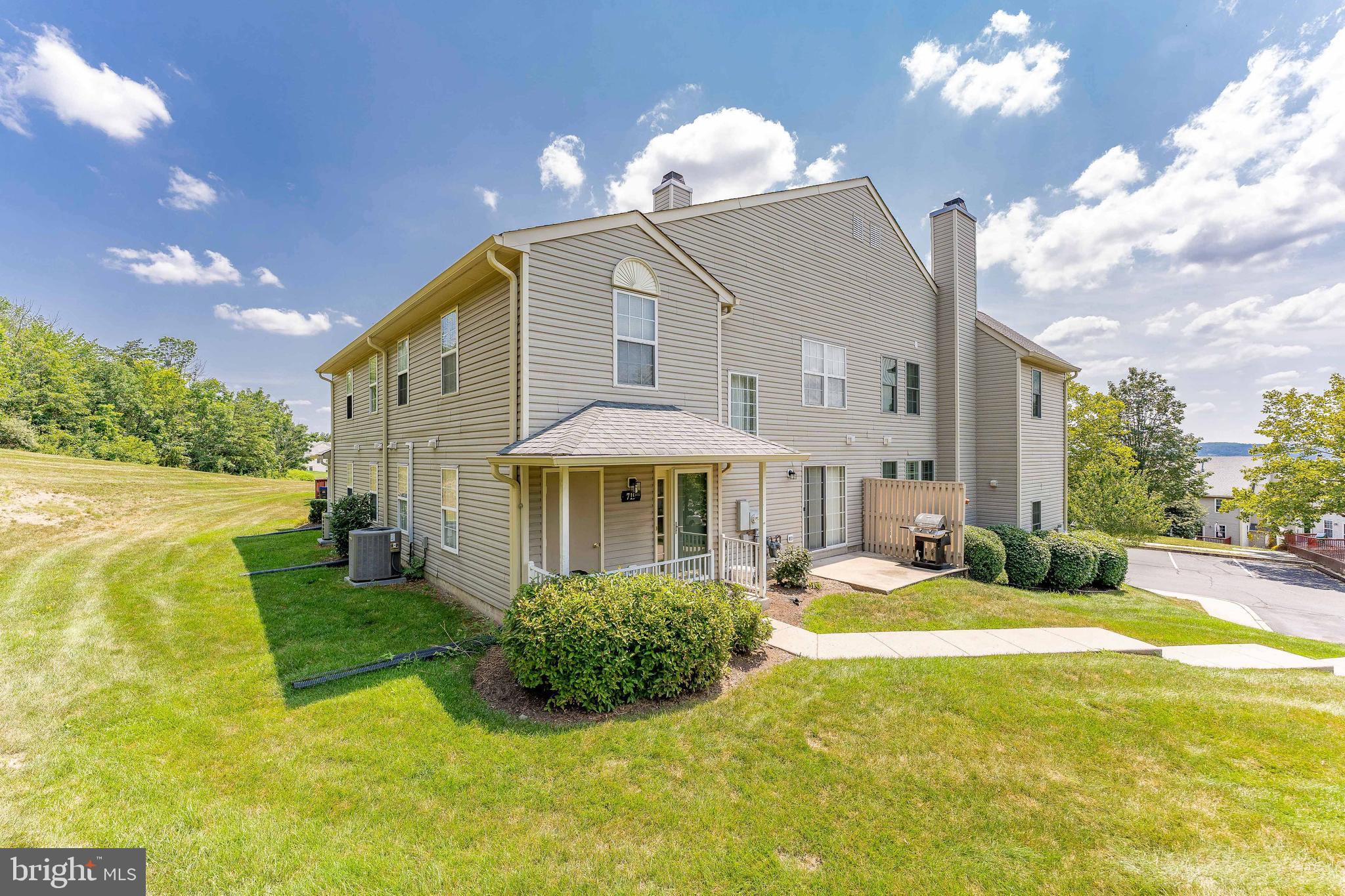 Welcome to 719 Thornhill Drive, a spacious 3-bedroom, 2.5-bath end-unit nestled in the sought-after Providence View community in Collegeville. This charming home offers a bright and functional layout, modern conveniences, and access to exceptional community amenities. As you arrive, you're welcomed by a cozy front porch—perfect for morning coffee or greeting guests. Step inside to a well-lit foyer featuring a ceiling light and a coat closet for everyday convenience. Straight ahead, the inviting living room features plush carpet flooring and a gas fireplace with a classic wooden mantle—an ideal space to relax and unwind. Flowing from the living room is a hallway with a powder room (featuring tile flooring), an additional storage closet, and a staircase leading to the second level. The dining room offers carpet flooring, a stylish chandelier, and a sliding glass door that opens to a small patio—perfect for outdoor grilling or dining. A half wall connects the dining area to the eat-in kitchen, which boasts hardwood floors, granite countertops, a tile backsplash, a double sink, Kenmore appliances, and a pantry closet. Just off the kitchen is the laundry/utility room with built-in shelving, a ceiling light, and a washer and dryer. Upstairs, the spacious primary bedroom features a double-door entry, vaulted ceiling, carpet flooring, a ceiling fan with light, and a large walk-in closet. The en-suite bath includes tile flooring and a step-in tiled shower. Two additional bedrooms on this level each have carpet flooring, ceiling fans with lights, and are perfect for children, guests, or a home office. A full hall bathroom with tile floors and a tiled tub/shower combo completes the upper level. Home improvements include: bathrooms have been renovated, new appliances installed, recessed lighting added and all outlets have been changed. Additional features include an attached exterior storage shed and assigned parking. Living in Providence View means enjoying a low-maintenance lifestyle with incredible community amenities, including a swimming pool, fitness center, tennis courts, playground (tot-lot), and a scenic pond. The condo fee covers exterior maintenance—including roof and siding—plus snow removal, trash service, and landscaping, allowing you to enjoy your home without the hassle. Don’t miss your chance to call this wonderful property your new home!