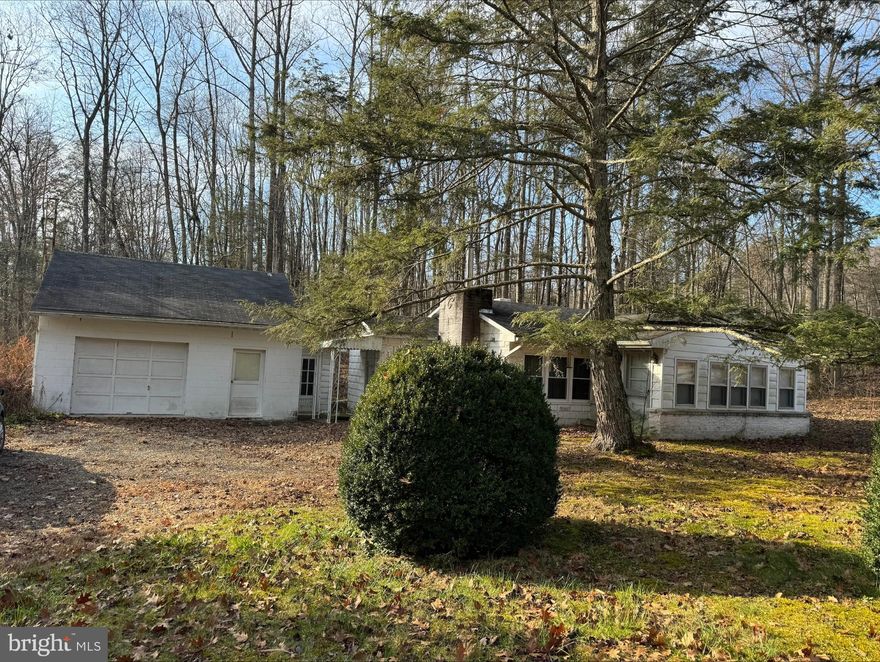 2 to 3 Bedroom Cottage on 1/2-acre minutes from town. Far enough and close enough from town. Propane heat with working fireplace. Modern kitchen and bath. 1 car detached garage and workshop. Nice size yard. Plenty of off-street parking. Downsize with on floor living or a great getaway in the country.