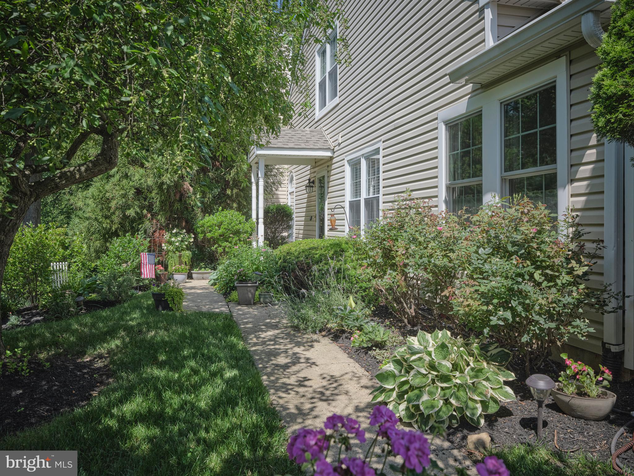 Welcome to Canterbury Croft a charming community located in Village Shires. This well maintained two bedroom, 2.5 bath townhome style condo offers style and comfort within this quiet enclave in Holland. Step through the front door into an inviting foyer with engineered hardwood flooring. Directly to the left is the living room with dramatic vaulted ceiling - with stairs leading to the upper level - fireplace with electric insert, newer carpet and sliding glass doors that lead to a new 11 x 11 deck overlooking a lush, private backyard framed by trees.
The formal dining room features chair molding, two bright windows and wood flooring. Just beyond the eat-in kitchen features oak cabinetry, smooth surface electric range, Kitchen Aid dishwasher, french door refrigerator with ice maker, and a stainless steel sink with disposal. Sliding french doors lead to a sweet, secluded 8 x 13 patio which also offers convenient access to the attached one car garage.
The main floor primary suite offers a spacious bedroom with a box bay window, ceiling fan, walk-in closet and a versatile 10 x 9 sitting room with an additional closet. The primary bath includes a double vanity, soaking tub, tiled shower and ceramic tile flooring..
Upstairs is a second bedroom with its own full bath with ceramic tile floors and shower, single vanity. THis bedroom features a cozy sitting area with two large closets. A 22' x 4' storage closet offers exceptional space for luggage, off season clothes, holiday decorations and more.
The basement level includes multiple storage spaces as well as a 16 x 11 unfinished space with outside access via sliding glass doors to a covered patio, The space has the potential to be a family room, office or possible guest room conversion.
Additional features include - newer roofing and siding, replaced windows in primary bedroom, new hot water heater, new compressor. The community offers resort style amenities including pools, tennis, playgrounds and walking trails. Easy access to major commuting routes, shopping and dining, this home has it all.