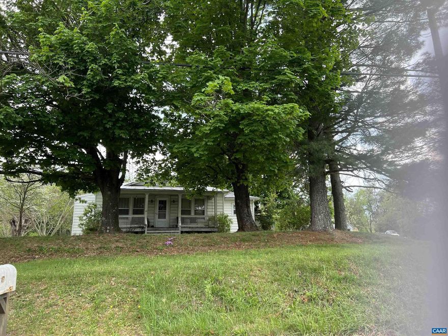 Bungalow w/good bones built 1936. New front porch  Great possibilities live in rent and 3 huge car garage for hobbies cars your own business and great opportunity.  Down street is 2 lots on 380 parkersburg Turnpike with mobile home and total almost 3 acres so buy subject home and mobile home & almost 3 acs. for $355,000 if interest all owned same owner & separate mls under land.  more pics soon.  Sold AS IS,Formica Counter,Painted Cabinets
