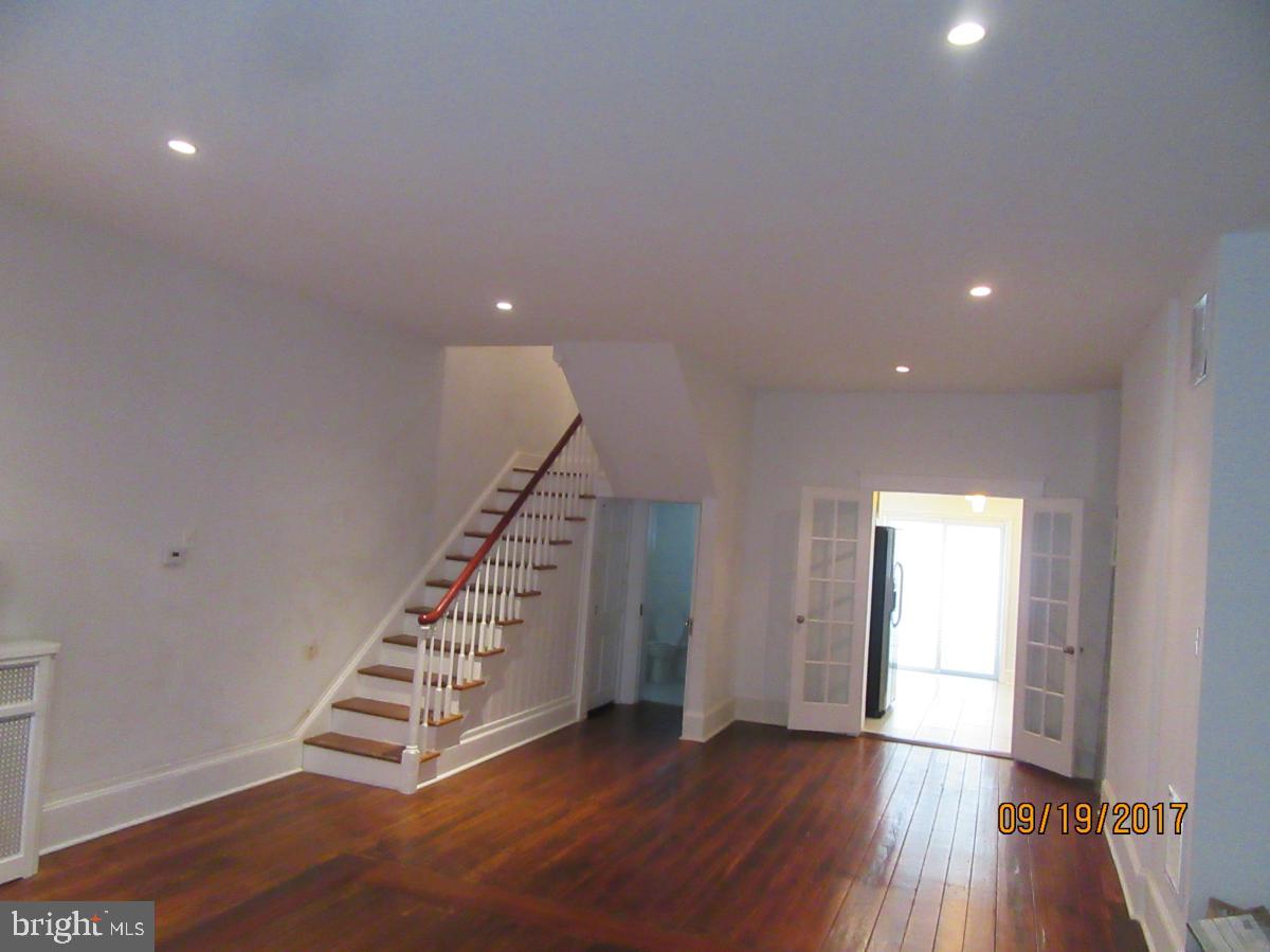A Nice Size 4 Bedroom, 1.5 Bath Home! Completely Rehabbed with lots of Character & Original Detail. First Floor: Wide Open Living Room/Dining Room with Gorgeous Pine Floors, High Ceilings, Marble Powder Room, French Doors leading to a Beautiful Kitchen with Granite Counter-tops, Stainless Steel Appliances, Glass back-splash and a Huge yard. An Original Staircase leads you to 2 large Bedrooms each with their own fireplace, Pine Floors, Exposed Brick, Good Closet Space, Full Tile Bath with Claw Soaking Tub and Built ins. Third Floor: 2 Dormer Rooms each with their own fireplace and Original Hardwood Floors. Basement is finished with Mechanicals & Storage.