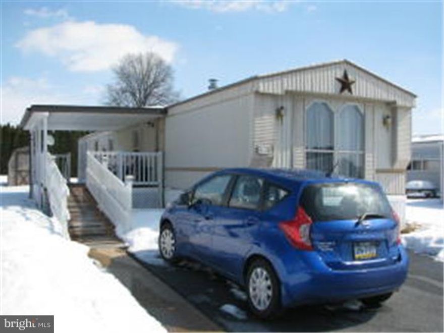 Nice interior of this 1994 Fleetwood Mobile Home with ramp & roof covered deck.  It features a living room, kitchen/dining room combo, master bedroom with full bath that has a walk-in shower & walk-in closet, hall-entered half-bath & another bedroom. All of the appliances stay.  Lots of cabinets & storage area. Shed & Patio. Gas Furnace new in 2012. Buyer will need park approval. Lot Rent 325 per month. Includes water, sewer & trash.