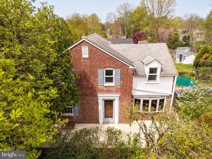 Welcome to 201 Glendalough Road, a classic brick Colonial set on a desirable corner lot in the sought-after Chesney Downs neighborhood of Springfield Township. First time on the market in 38 years, this well-loved and well-maintained 3-bedroom, 1.5-bath home offers timeless character of homes built in the 1940’s, combined with thoughtful updates and additions and a location that’s hard to beat.
The freshly painted interior is complemented by original oak hardwood floors that run throughout much of the home, adding warmth, easy living style and continuity. The main level offers a comfortable flow with inviting living and dining spaces, ideal for both everyday living and entertaining. Natural light fills the home through a mix of original and updated windows, creating a bright and welcoming atmosphere. The Living Room opens to the Dining Room which is open to the remodeled Kitchen/Breakfast Area and Rear Entryway (bathed in light from a large bay widow), leading to a lovely Covered Screened Porch. A Powder Room and first floor Laundry alcove complete this end of the home. Make your way through the sliding barn-style door into the generously-sized Family Room, with two bay windows overlooking the well-tended flower gardens and lush landscaping within the fully-fenced front and side yards. Carefully placed flagstone walkways wind-through the garden to a charming garden shed, or around to a full-length patio spanning the entire width of the front of the home.
Upstairs, three nicely sized bedrooms share a full hall bath, while a convenient powder room is located on the main floor. With 1,530 square feet of living space, this home provides the perfect opportunity to move right in while also leaving room to further personalize over time. The basement provides for plenty of storage and workspace, and is outfitted with a newer gas furnace and central air conditioning
Situated on a 0.19-acre corner lot, the property offers added privacy and outdoor space for relaxing, gardening, or gathering with friends and family.
Chesney Downs is known for its strong sense of community and neighborhood charm, with annual block parties and holiday traditions that make it a special place to call home.  Located within the award-winning Springfield Township School District and just minutes from Chestnut Hill, Route 309, the PA Turnpike, and local parks, this home combines suburban comfort with convenient access to everything you need.
This is your opportunity to settle in one of the area’s most desirable neighborhoods—schedule your showing today.