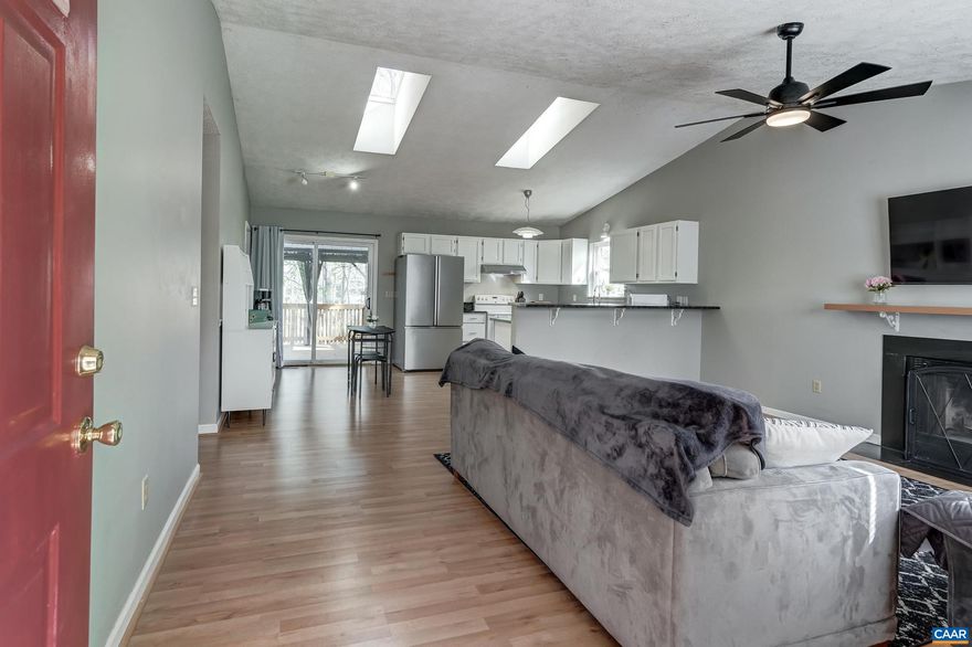 Welcome to this beautifully updated ranch-style home in the highly sought-after Lake Monticello community! Offering approximately 2,350 square feet of finished living space, this 4-bedroom, 3 full bath home combines comfort, functionality, and modern updates in a serene lake setting. Step inside to discover an updated kitchen featuring granite countertops and a functional layout perfect for everyday living and entertaining. The main level includes a convenient first-floor bedroom with a full bath, while the fully finished basement?complete with brand new carpet?provides additional living space, a full bathroom, and a versatile workshop area. Enjoy outdoor living with a brand-new back deck overlooking the property, along with thoughtful exterior improvements including a retaining wall and drainage system. The home also features a newer HVAC system (2019), a roof replaced in 2013, public water and sewer, and fiber internet availability for modern convenience. Located on a .35-acre lot in a gated community, residents enjoy access to exceptional Lake Monticello amenities including a private lake, beach, marina, golf course, pool, clubhouse, and more. HOA includes road maintenance, snow removal, trash service, and limited yard mainten