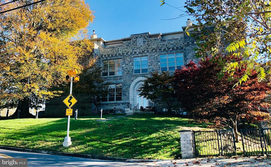 Overlooking Historic Ellicott City and the Patapsco Valley, this 1840s converted schoolhouse turned condo building is one of the areas best kept secrets. Enjoy the short walk downtown to stores, bars, restaurants and  Patapsco Valley State Park . This spacious and light filled 2 bedroom 2 bathroom unit has been lovingly maintained and features 12 foot ceilings, new floors, a wood burning fireplace and great views out to the common area. These condos are rarely available, so hurry and schedule your showing today!