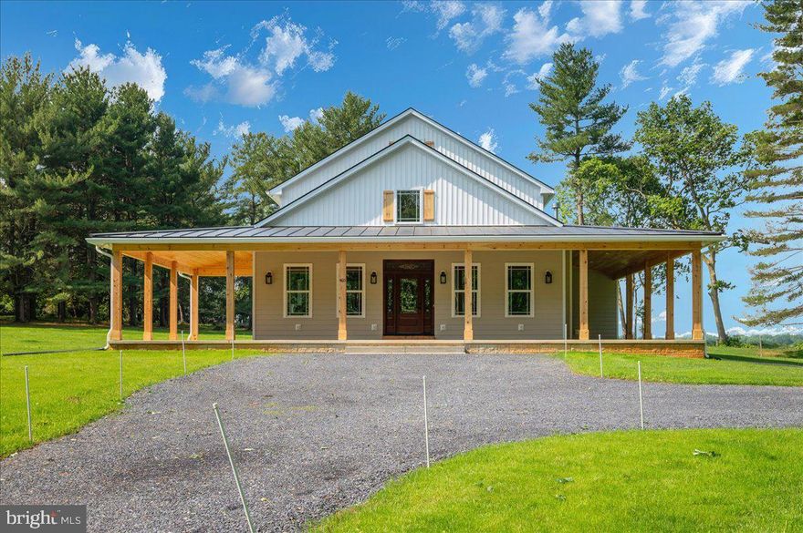 Don't wait on new construction when this beautifully completed 2025 custom-built home is move-in ready and offers the ideal setup for multigenerational living! Sitting on nearly 3 unrestricted acres and boasting over 5,600 square feet, this 5-bedroom, 4.5-bathroom, four-level home is thoughtfully designed to provide space, privacy, and comfort for large or extended families. The heart of the home features gleaming hardwood floors throughout, granite countertops in both the kitchen and bathrooms, stainless steel appliances, and a spacious main-level master suite with a private den—perfect for in-laws or aging parents seeking single-level convenience. The main floor also includes a dedicated laundry area, mudroom, and a generous pantry with an outlet for a freezer, making everyday living highly functional for a busy household. What truly sets this home apart is the layout: with three separate living areas located on the main level, second floor, and third floor, there's room for every generation to have their own space while still being under one roof. Whether it’s teens needing a hangout space, adult children working remotely, or grandparents enjoying quiet relaxation, the home's design offers flexibility and flow for every stage of life.
Built with exceptional attention to detail, the home features stunning Tongue and Groove pine ceilings that extend throughout the main level and out to the 12-foot-wide wraparound porch topped with a standing seam metal roof—ideal for family gatherings or quiet morning coffee. Energy efficiency abounds with 2x6 exterior walls, a combination of spray foam and fiberglass insulation, triple-glazed windows, a hybrid hot water heater, and a whole-house humidifier and water filtration system. The 100-gallon-per-minute well ensures a reliable and abundant water supply. With extensive storage, high-end finishes, and a custom floor plan that supports both shared and private living, this home is a rare find for families looking to live together comfortably and with style. Schedule your private tour today and experience firsthand how this exceptional home can bring generations together under one roof.